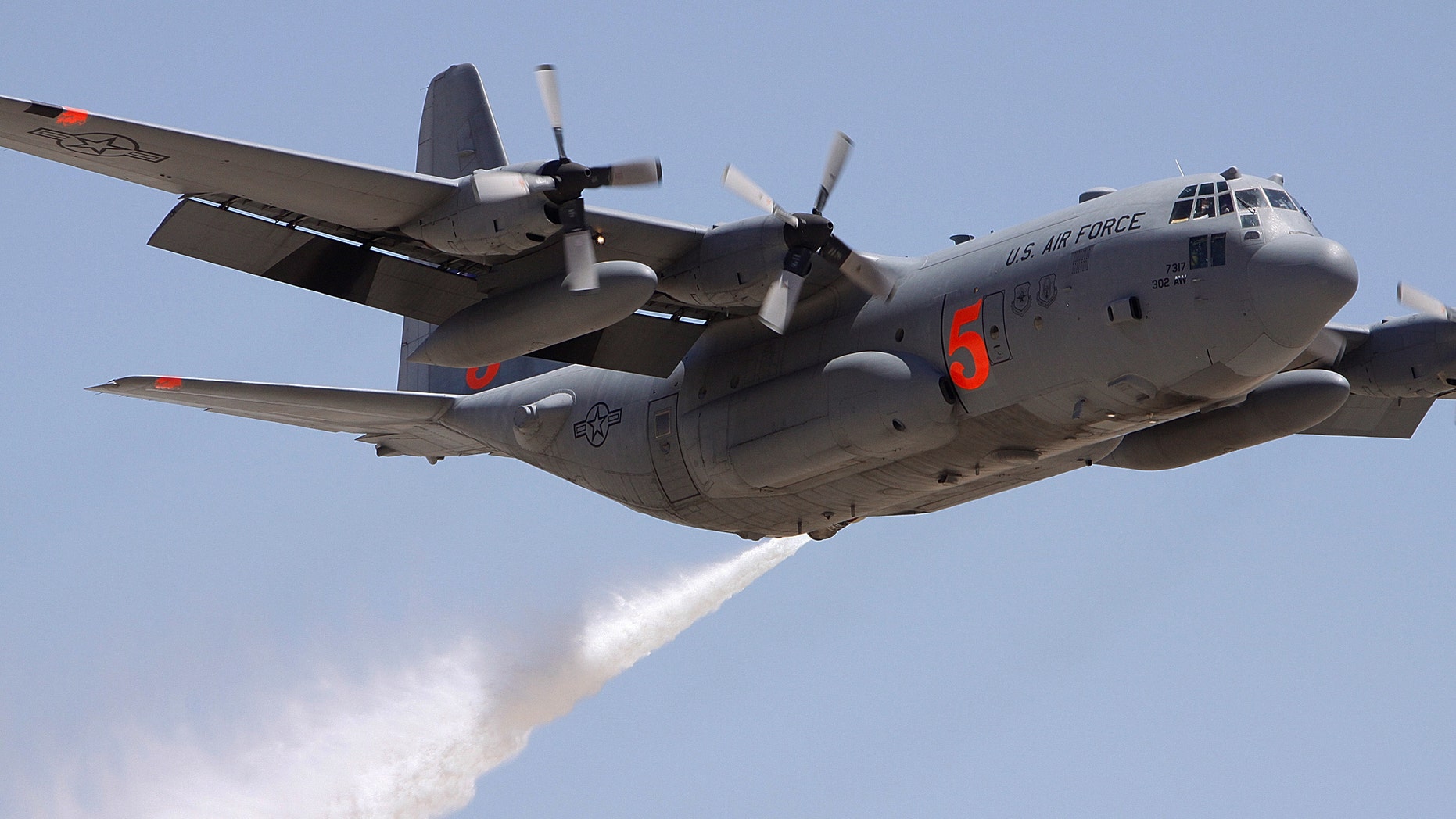 FILE 2009: Colorado Reserve C-130 drops water on a target during a certification flight at the Tucson International Airport.