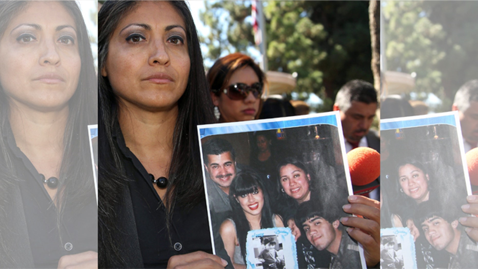 FILE - In this Oct. 2, 2014 file photo, attorney Claudia Osuna holds a photo of the Crespo family - from top left to bottom right, Bell Gardens, Calif., Mayor Daniel Crespo, his daughter Crystal, his wife Lyvette and son Daniel Crespo Jr., during a news conference in the Los Angeles surbuban city of Bell Gardens. A Los Angeles County grand jury has indicted Lyvette Crespo on a charge of voluntary manslaughter the shooting death of Daniel Crespo. The district attorneyâs office says Lyvette Crespo pleaded not guilty Thursday, April 23, 2015, during an arraignment at which the indictment was unsealed. The 45 year-old mayor was fatally shot at his home on Sept. 30, 2014. (AP Photo/Nick Ut, File)