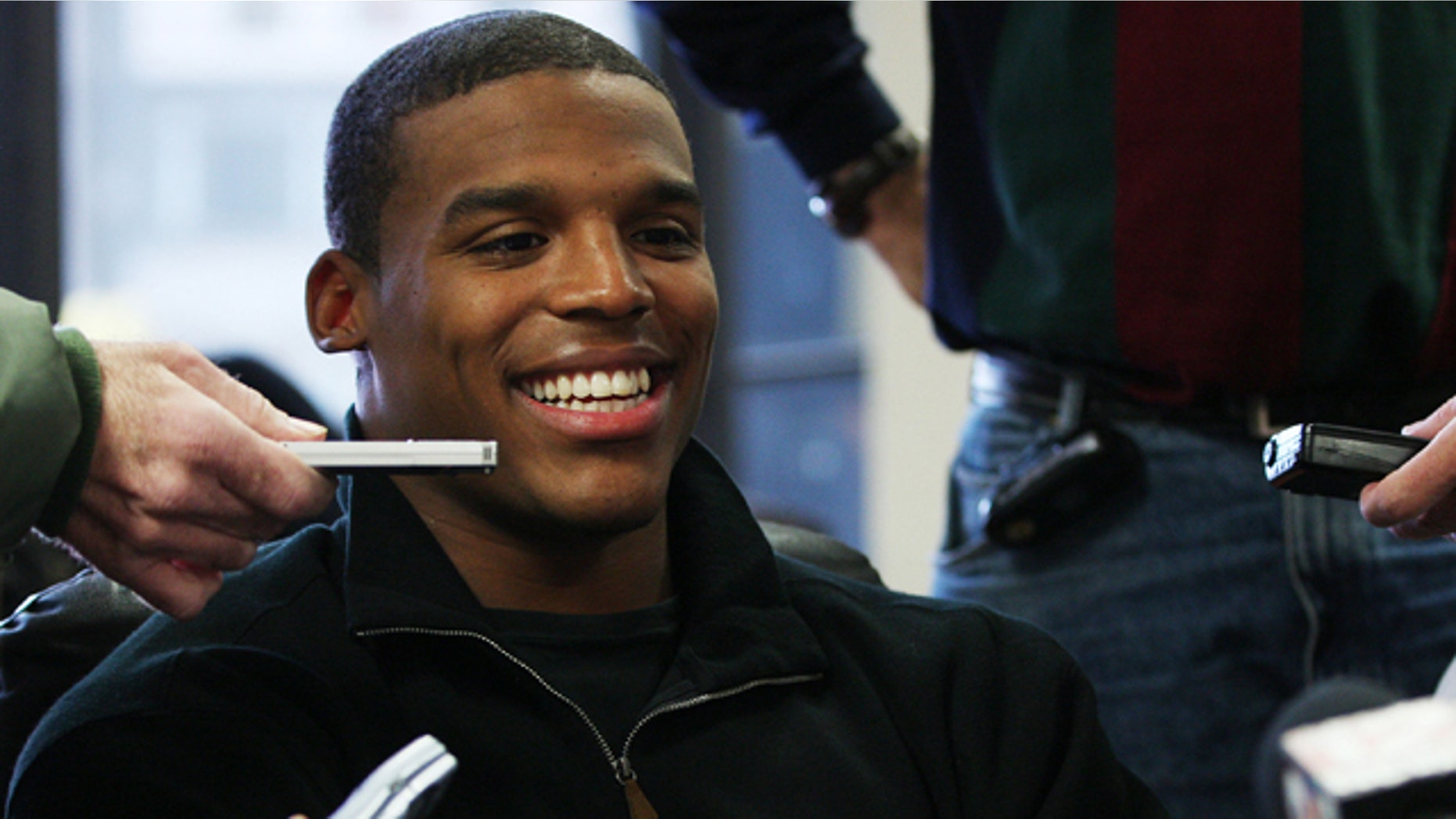 Heisman candidate Cam Newton, quarterback for Auburn, speaks to reporters during a news conference on Friday