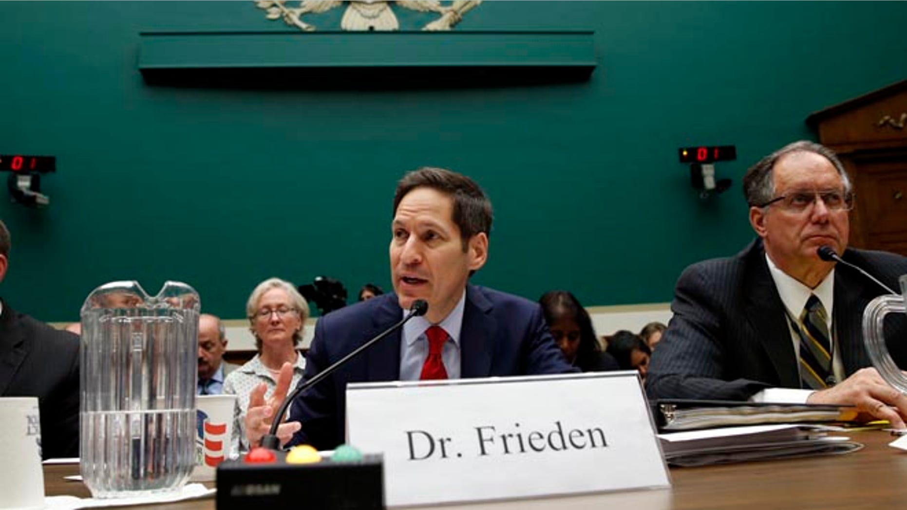 U.S. Centers for Disease Control and Prevention (CDC) Director Tom Frieden testifies at a House Energy and Commerce Subcommittee on Oversight and Investigations hearing called the "Review of CDC Anthrax Lab Incident" on Capitol Hill in Washington July 16, 2014. Flanking Frieden are Joseph Henderson (L), deputy director of the CDC's Office of Security and Emergency Preparedness, and Jere Dick, associate deputy administrator of the Animal and Plant Health Inspection Services at the U.S. Department of Agriculture.