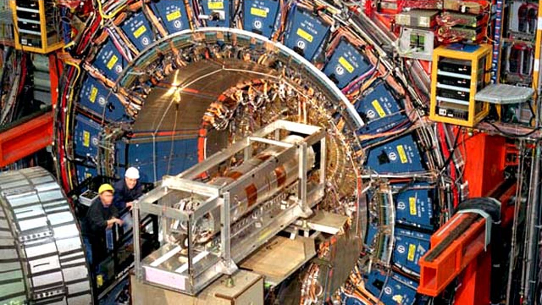 The CDF detector at U.S. science facility Fermilab. About the size of a three-story house, and weighing about 6,000 tons, it records the "debris" emerging from each high-energy proton-antiproton collision produced by the Tevatron particle colider.