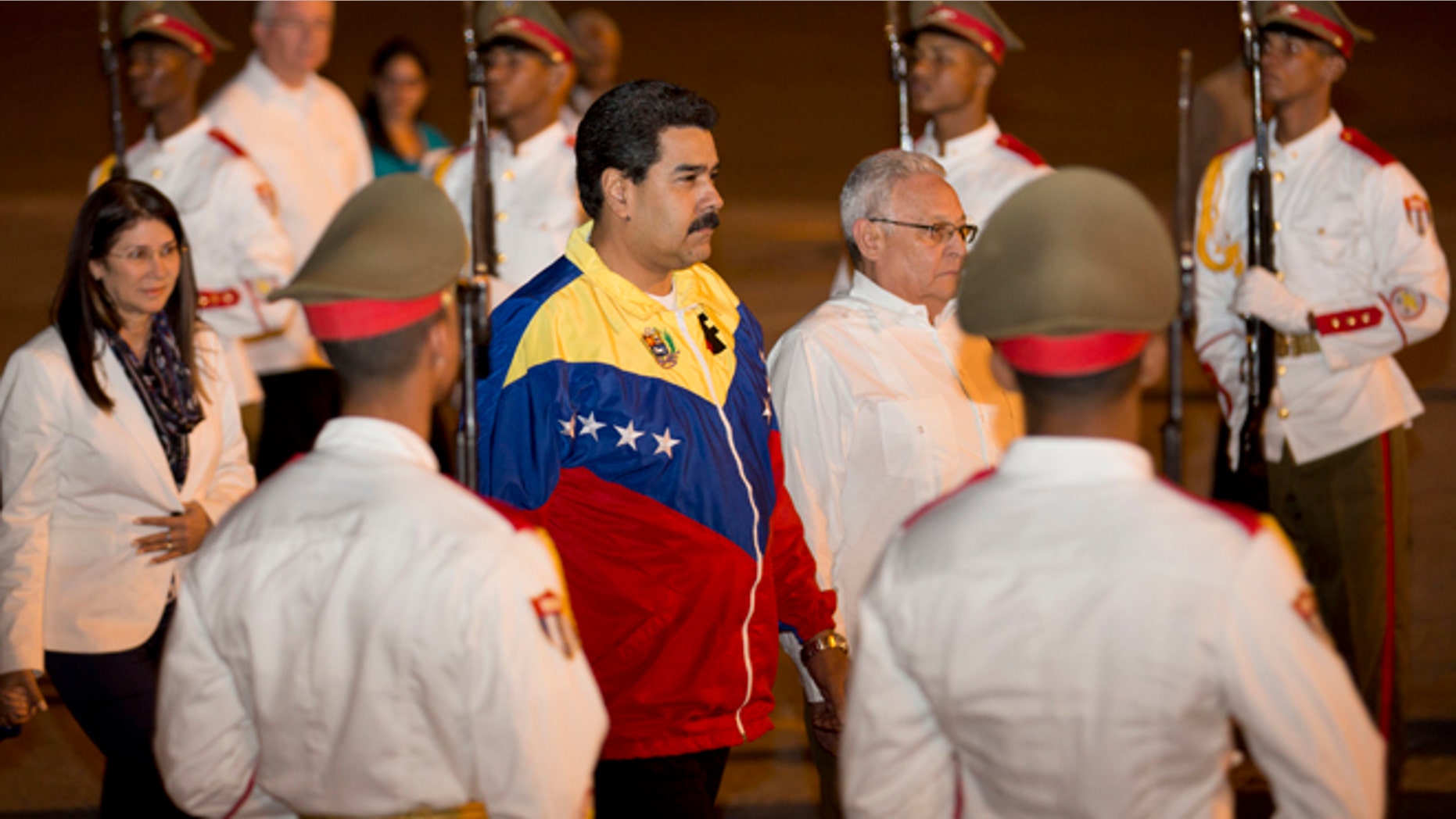 Venezuela's President Nicolas Maduro, center, arrives at the Jose Marti International airport in Havana, Cuba, Sunday, Jan. 26, 2014. Leaders from Latin America and the Caribbean are arriving in Havana this week to participate in the Community of Latin American and Caribbean States, or CELAC summit. Lower-level officials began meeting over the weekend and foreign ministers are taking the stage Monday. The formal meetings of heads of state begin Tuesday. (AP Photo/Ramon Espinosa)