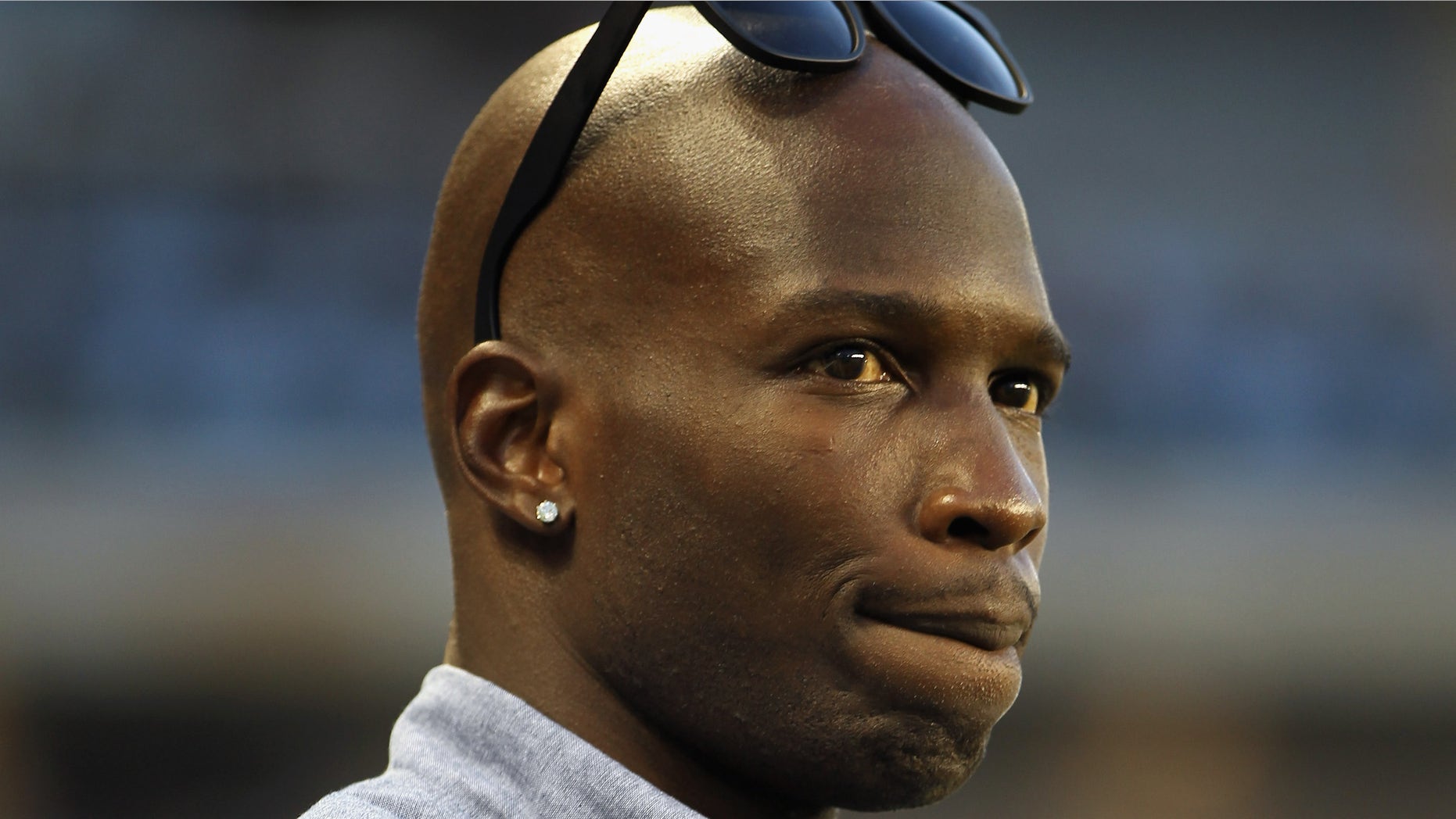 KANSAS CITY, KS - JUNE 09: Chad Ochocinco watches practice from the sidelines prior to the innaugural game between the Chicago Fire and Sporting Kansas City at LiveStrong Sporting Park on June 9, 2011 in Kansas City, Kansas. (Photo by Jamie Squire/Getty Images)