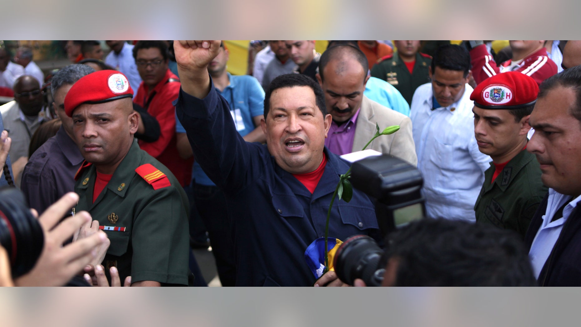 Venezuela's President Hugo Chavez arrives to a polling station during the presidential election in Caracas, Venezuela, Sunday, Oct. 7, 2012. Chavez is running for re-election against opposition candidate Henrique Capriles. (AP Photo/Rodrigo Abd)