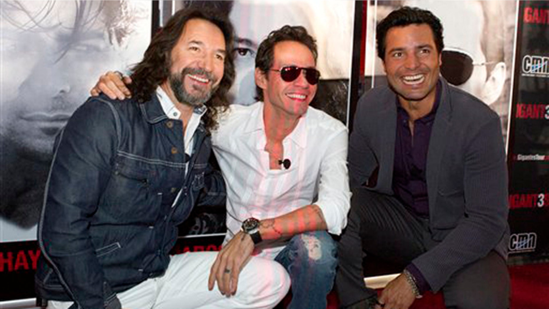 April 23, 2012: Marco Antonio Solis, left, Marc Anthony, center, and Chayanne, pose at the American Airlines Arena in Miami, Fla., to announce their National tour concert called "GIGANT3S." The tour will kick-off in Miami on Aug. 3.