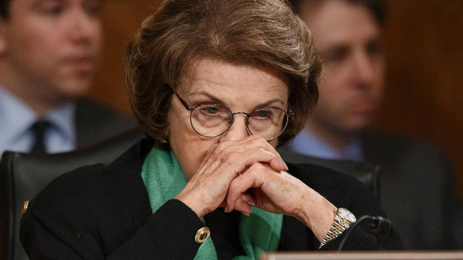 File- This March 13, 2014, file photo shows Senate Intelligence Committee Chair Sen. Dianne Feinstein, D-Calif., listening on Capitol Hill in Washington, during a Senate Transportation subcommittee hearing. In the aftermath of committee chairwoman Sen. Feinstein’s accusations that the CIA’s intimidating tactics and breaching of its constitutional authority for filing a criminal complaint against congressional aides, observers say the U.S. intelligence community and its congressional minders have committed serious missteps over the 13 years since the 9/11 terror attacks. (AP Photo/J. Scott Applewhite, File)