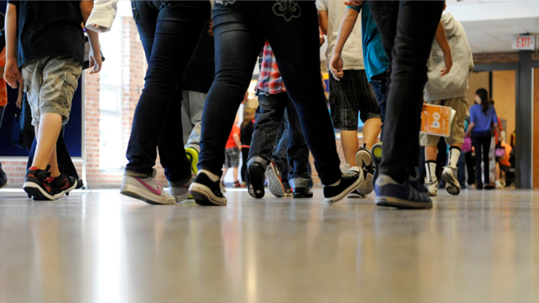 FILE - In this Sept. 11, 2012 file photo, students walk in the hallways as they enter the lunch line of the cafeteria at Draper Middle School in Rotterdam, N.Y. School for thousands of public school students is about to get quite a bit longer. Five states announced Monday, Dec. 3, 2012, they will add at least 300 hours of learning time to the calendar in some schools starting in 2013. (AP Photo/Hans Pennink, File)