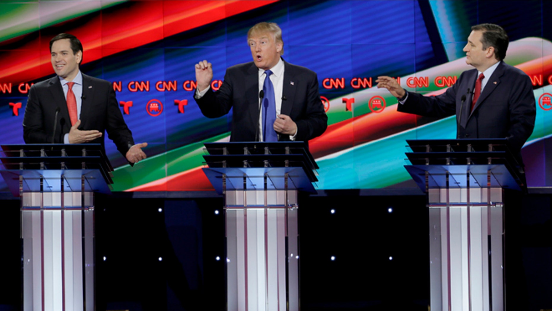 From left, Republican presidential candidate, Sen. Marco Rubio, R-Fla., Republican presidential candidate, businessman Donald Trump and Republican presidential candidate, Sen. Ted Cruz, R-Texas, speak and gesture during a Republican presidential primary debate at The University of Houston, Thursday, Feb. 25, 2016, in Houston. (AP Photo/David J. Phillip)