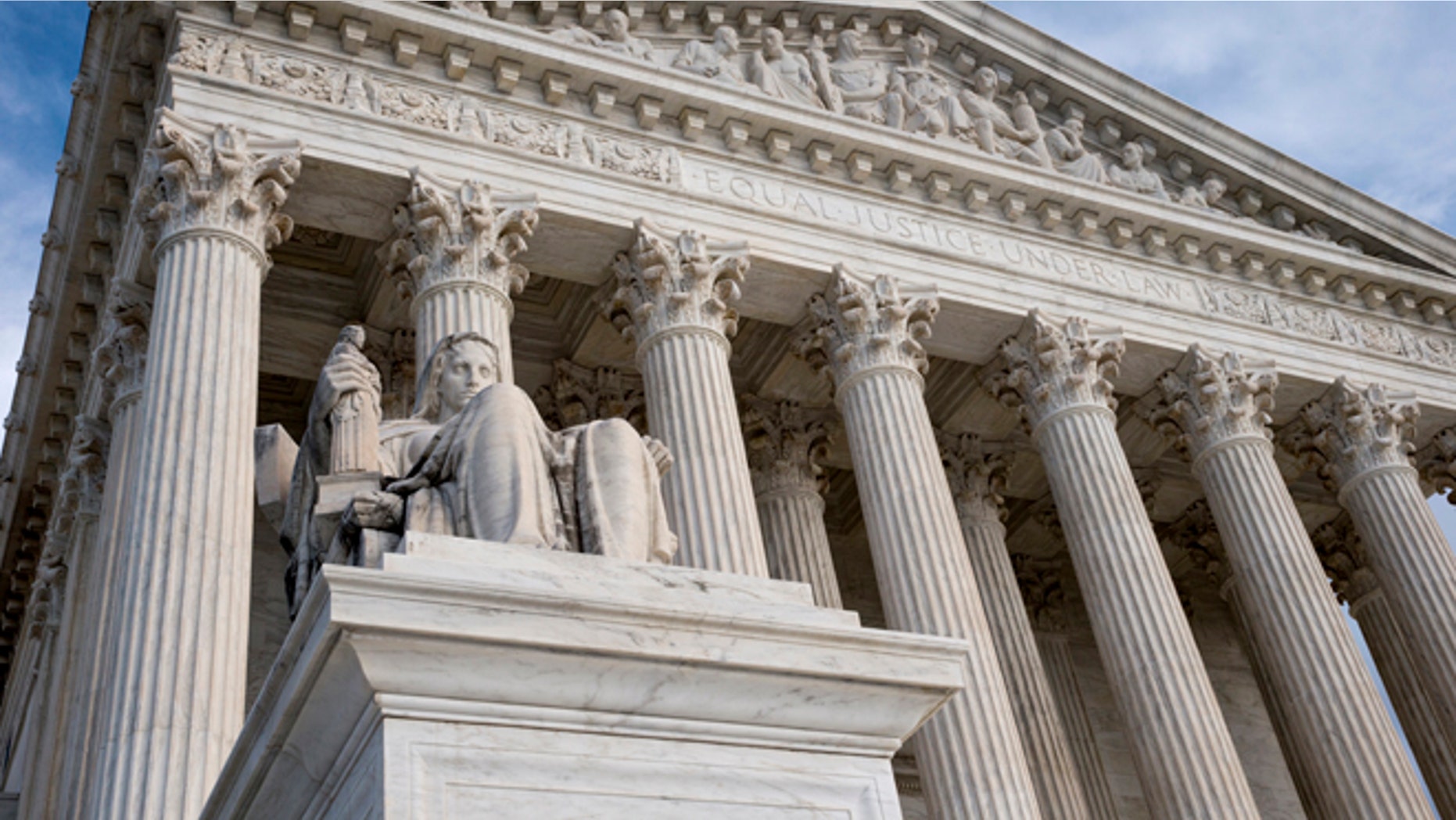 FILE - The Supreme Court in this Feb. 17, 2016 file photo. The Supreme Court is hearing an appeal from Colorado that claims a jurors ethnic slurs during deliberations were so offensive that they deprived the defendant of a fair trial. (AP Photo/J. Scott Applewhite)
