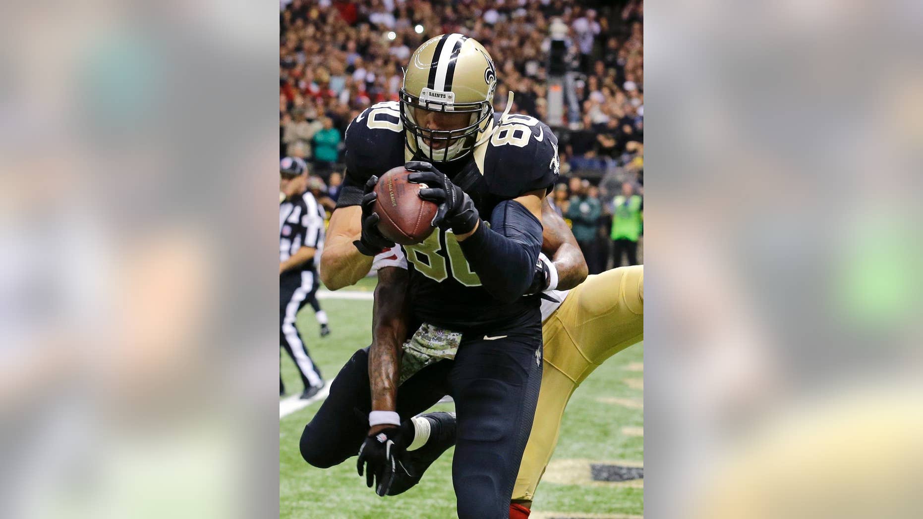 CORRECTS TO SECOND HALF - New Orleans Saints tight end Jimmy Graham (80) catches a touchdown pass in front of San Francisco 49ers cornerback Perrish Cox late in the second half of an NFL football game in New Orleans, Sunday, Nov. 9, 2014. (AP Photo/Bill Haber)