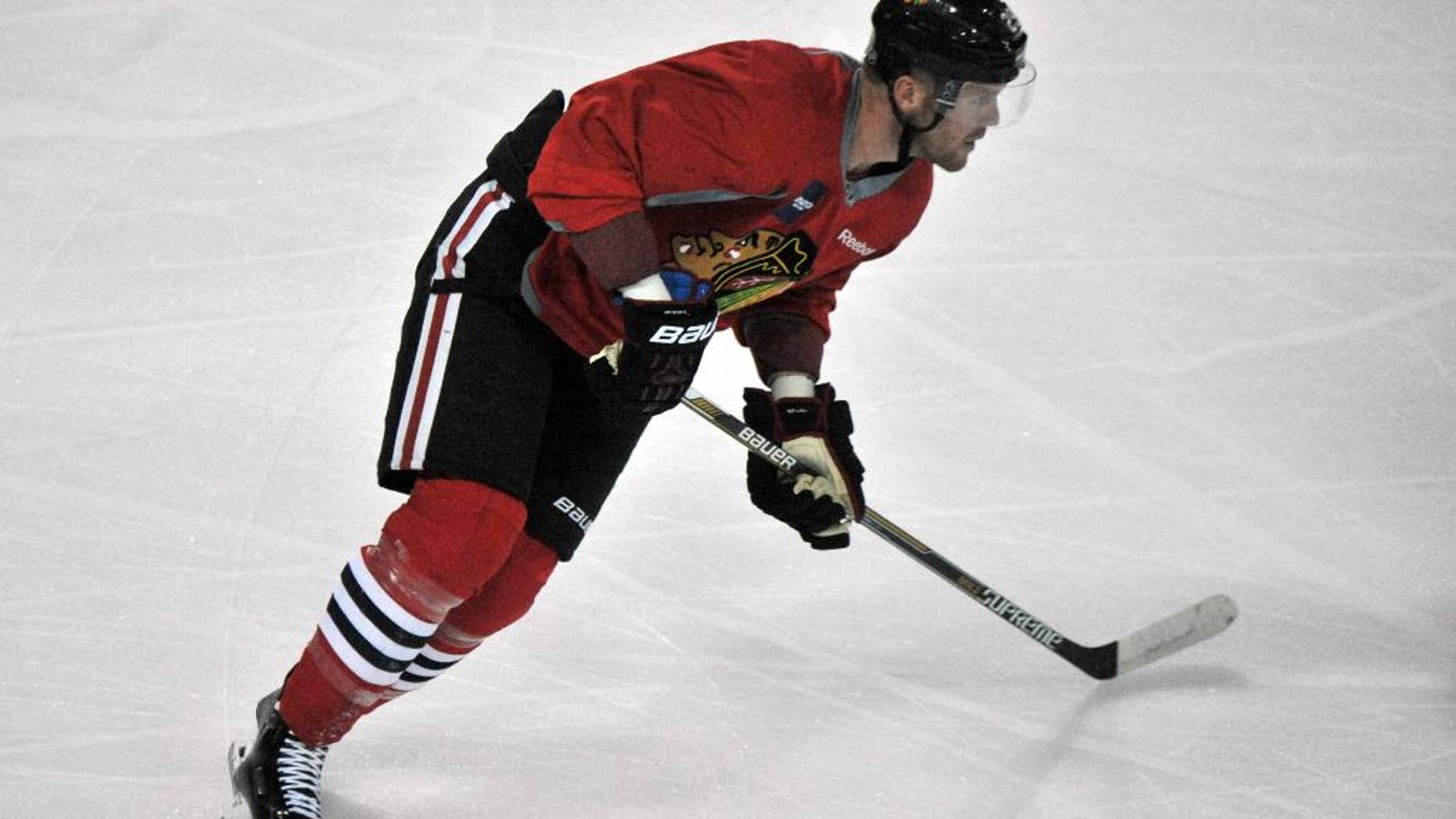 RETRANSMISSION TO CORRECT NAME TO BRYAN BICKELL FROM RYAN BICKELL - Chicago Blackhawks' Bryan Bickell skates during NHL hockey training camp at the Compton Family Ice Center on the campus of the University of Notre Dame in South Bend, Ind., Friday, Sept. 18, 2015. (AP Photo/Joe Raymond)