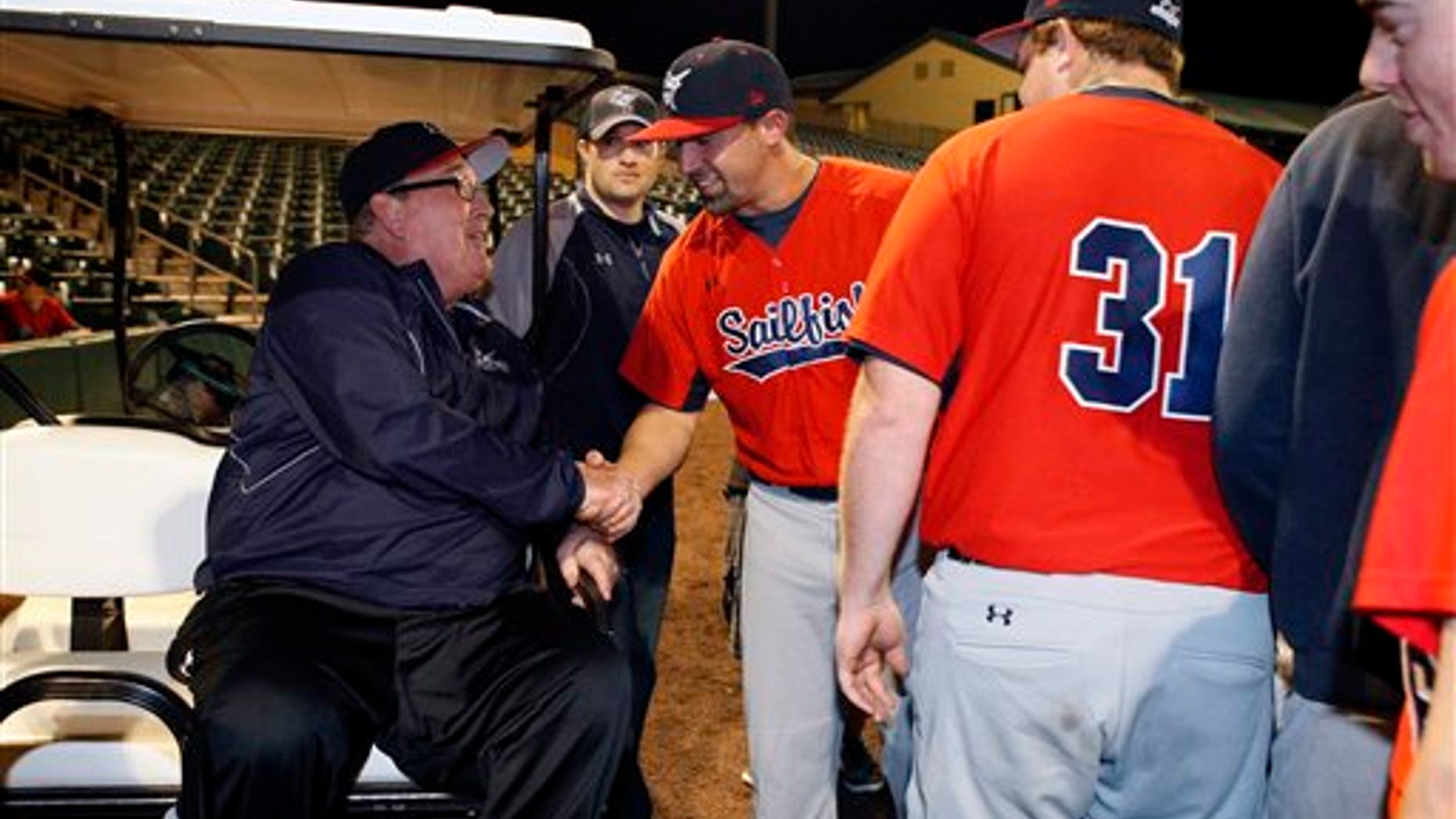 Feb. 2: Hall of Fame catcher and Palm Beach Atlantic University coach Gary Carter, left, greets players on the field before PBAU's baseball home opener at Roger Dean Stadium in Jupiter, Florida.
