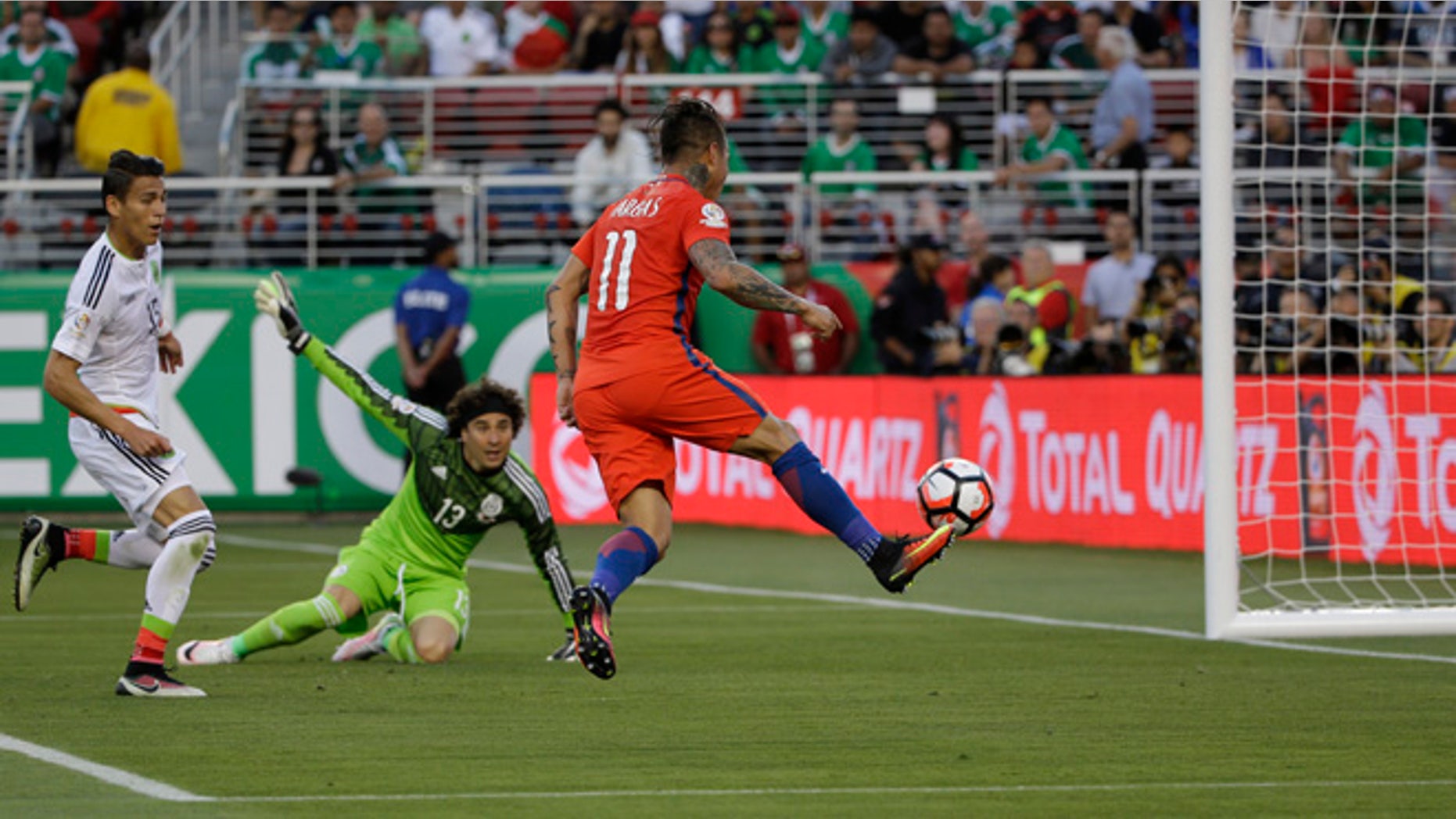 CORRECTS THAT THERE WAS NO GOAL, AS OFFSIDE WAS CALLED - Chileâs Eduardo Vargas hits the ball toward the goal against Mexico, but offside was called, during a Copa America Centenario soccer quarterfinal in Santa Clara, Calif., Saturday, June 18, 2016. (AP Photo/ Marcio Jose Sanchez)