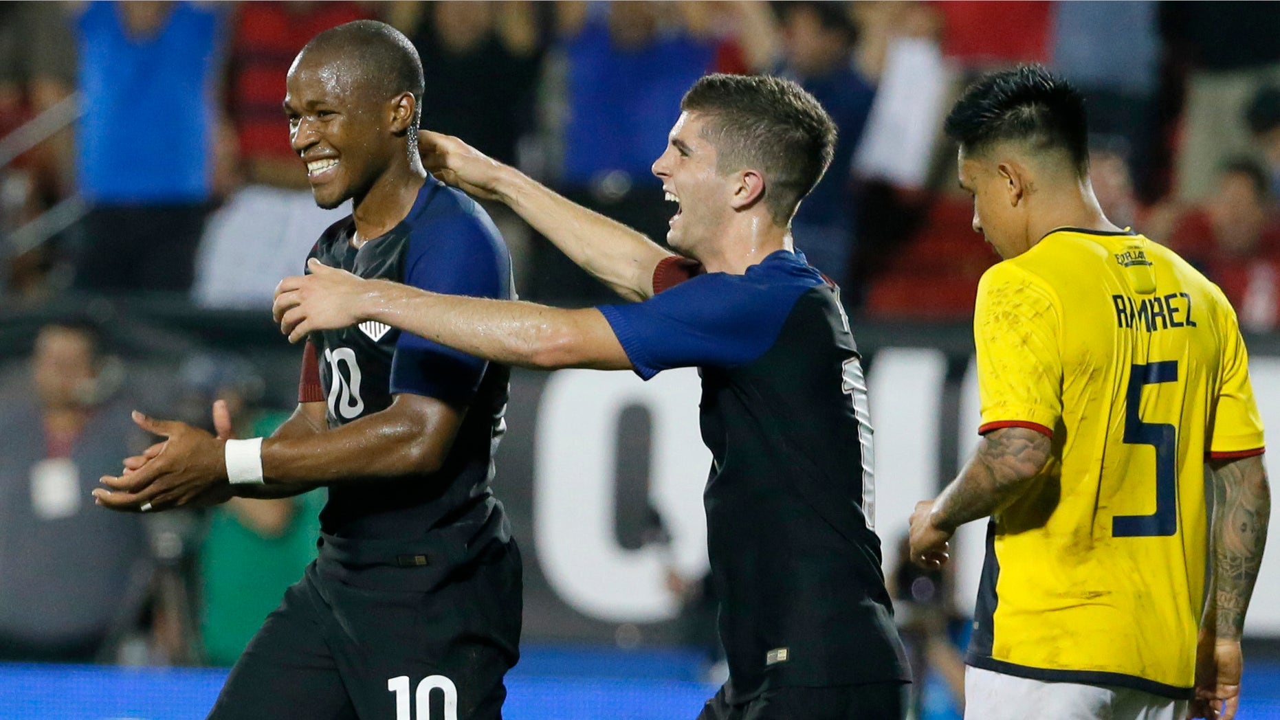 Darlington Nagbe and Christian Pulisic celebrate on Wednesday, May 25, 2016, in Frisco, Texas.