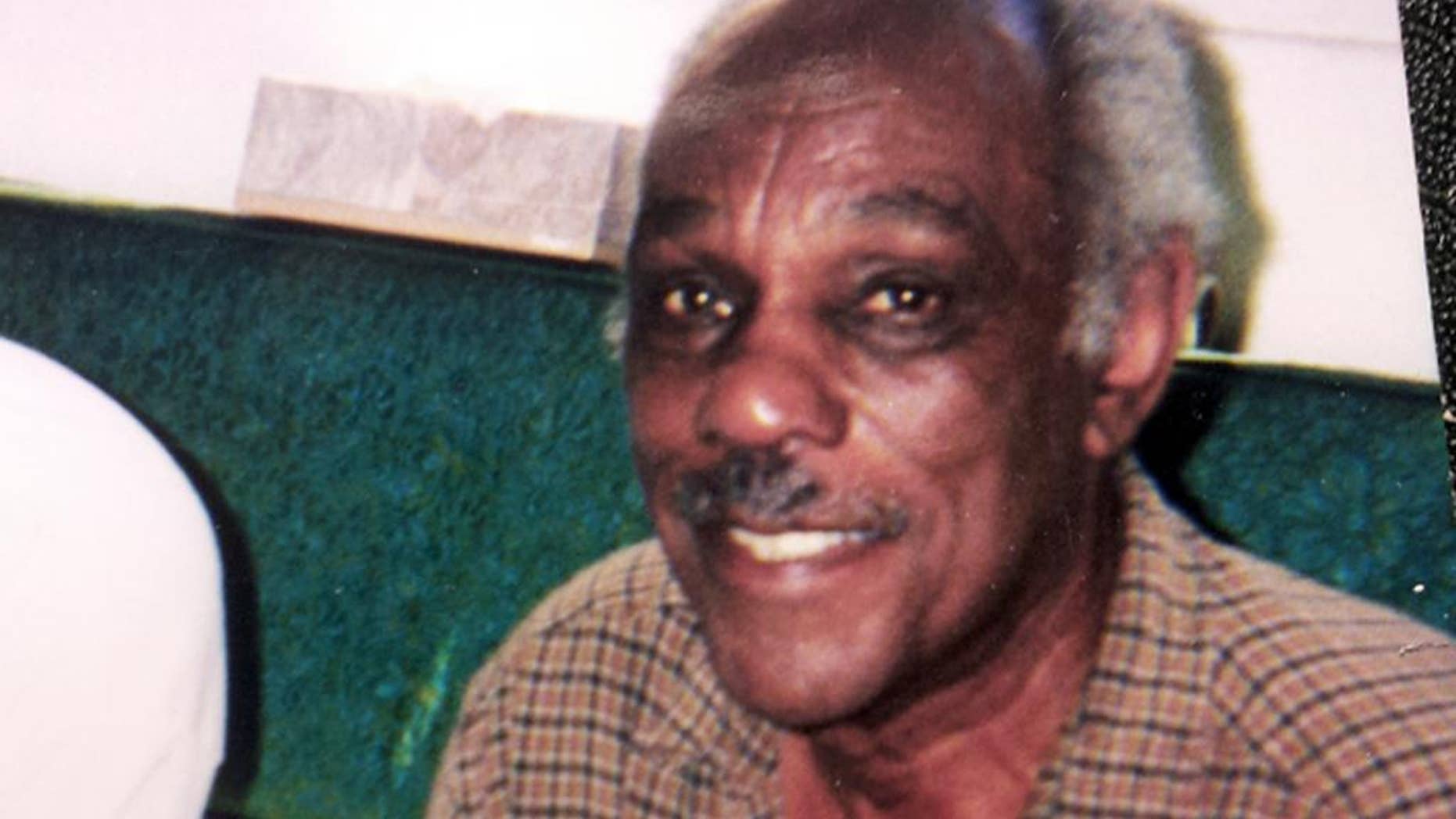 CORRECTS SPELLING OF LAST NAME TO SHAMBREY - This circa 2000 photo provided by Tim Shambrey shows his father, Joseph Shambrey, a member of the Tuskegee Airmen, the famed all-black squadron that flew in World War II, at his home in Los Angeles. Shambrey and fellow Tuskegee Airman Clarence E. "Buddy" Huntley Jr., lifelong friends who enlisted together, both died on the same day, Monday, Jan. 5, 2015, in their Los Angeles homes, relatives said Sunday, Jan. 11, 2015. Both were 91. Huntley and Shambrey enlisted in 1942 and were shipped overseas to Italy in 1944 with the 100th Fighter Squadron of the Army Air Force's 332nd Fighter Group. As mechanics, they kept the combat planes flying.(AP Photo/Courtesy Tim Shambray)