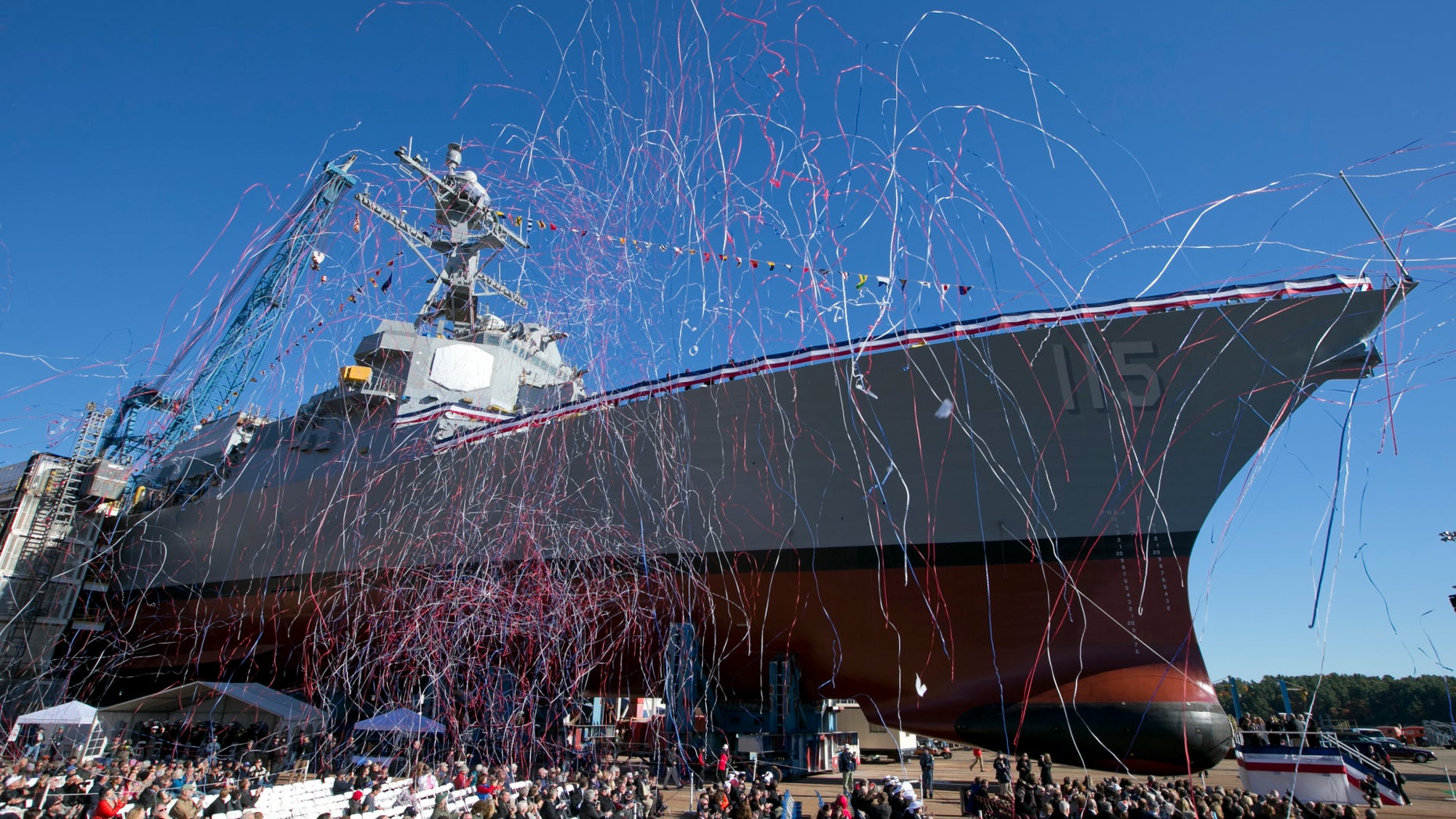 Streamers fly during the christening the USS Rafael Peralta on Saturday, Oct. 31, 2015, in Bath, Maine