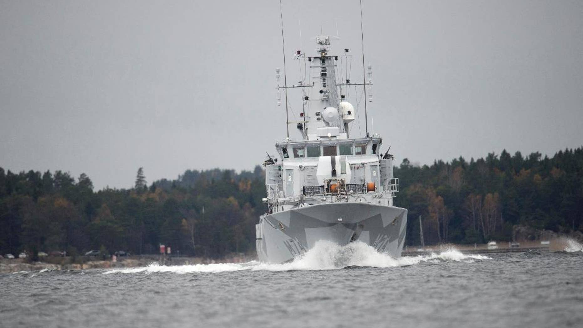 CORRECTS YEAR - The Swedish minesweeper HMS Kullen under way in Namdo Bay, Sweden, Tuesday, Oct. 21, 2014 on their fifth day of searching for a suspected foreign vessel in the Stockholm archipelago. The navy has demanded a 1000-meter, (yard) no-go radius around naval vessels taking part in the current operation. (AP Photo/Fredrik Sandberg) SWEDEN OUT