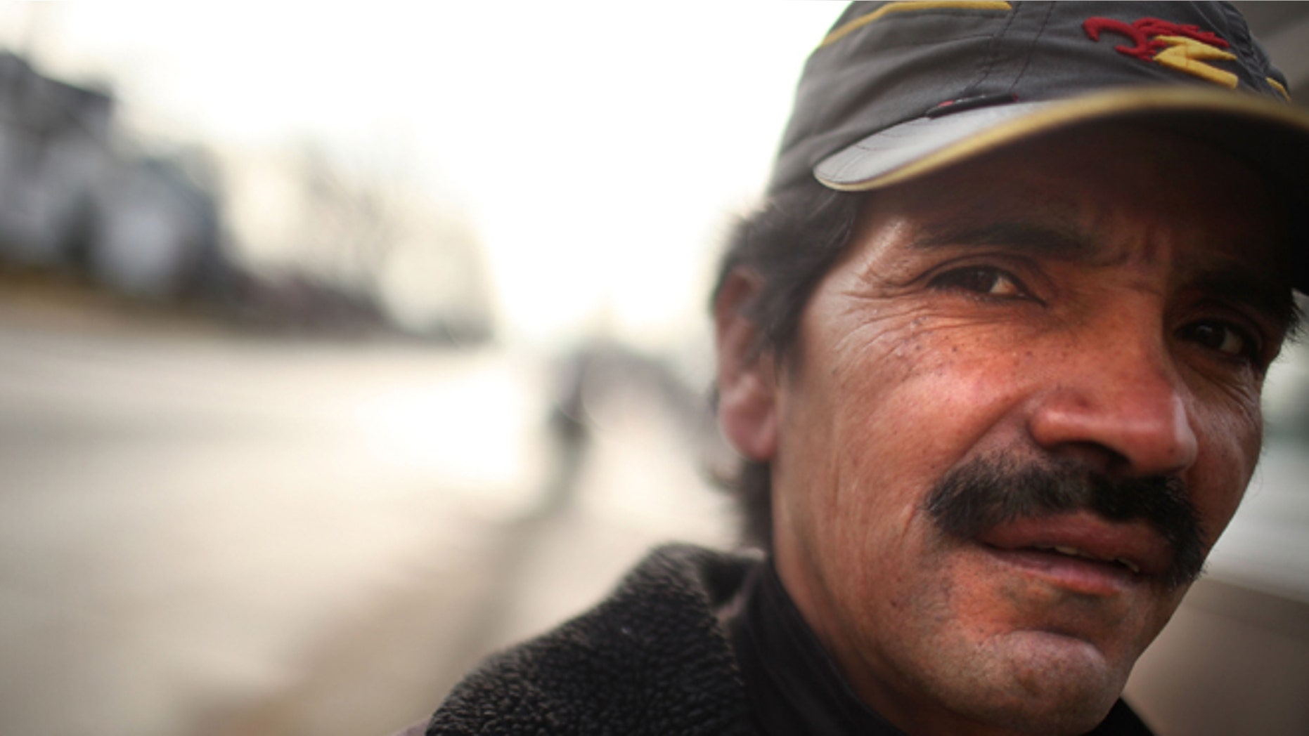 EAST HAVEN, CT - FEBRUARY 01: An Ecuadorian laborer stands in the street on February 1, 2012 in East Haven, Connecticut. Following an investigation by the FBI, four East Haven police officers were arrested last week and accused of abusing Latinos in the working class community of 28,000 people which was nearly predominately white a generation ago. A recent civil rights investigation which was released last month revealed a pattern of discriminatory policing in East Haven and the town has been warned by the U.S. Justice Department to make reforms. The arrested officers have been accused of subjecting Hispanics to beatings and false arrests among other things. Currently East Haven's Latino population is around 10 percent. (Photo by Spencer Platt/Getty Images)
