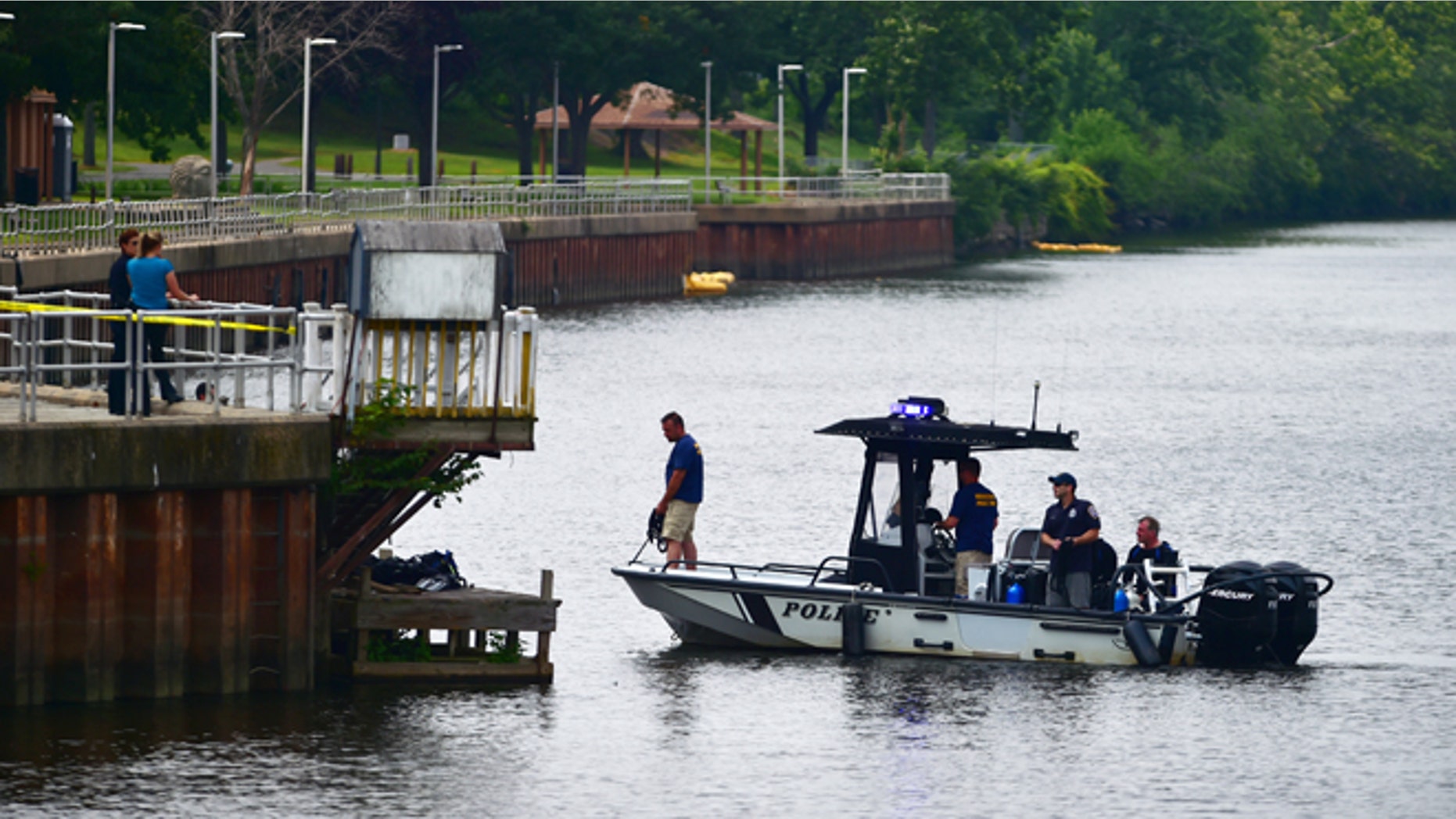 Authorities continue a search of the Connecticut River for a missing child, Monday, July 6, 2015, in Middletown, Conn. Police issued an alert Monday for 7-month-old Aaden Moreno, who may have been with his father when the man jumped from the Arrigoni Bridge Sunday night. (Catherine Avalone/The New Haven Register via AP) MANDATORY CREDIT