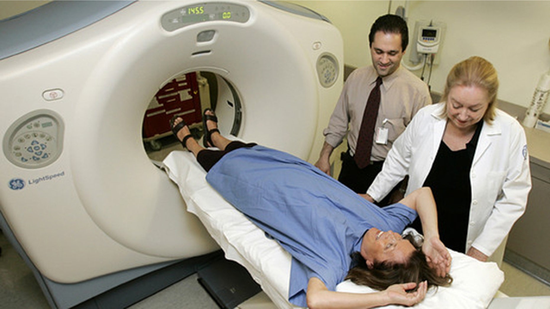 Dr. Claudia Henschke and CT supervisor Gus Daphnis prepare a patient for her lung scan at New York Hospital on Aug. 12, 2005.
