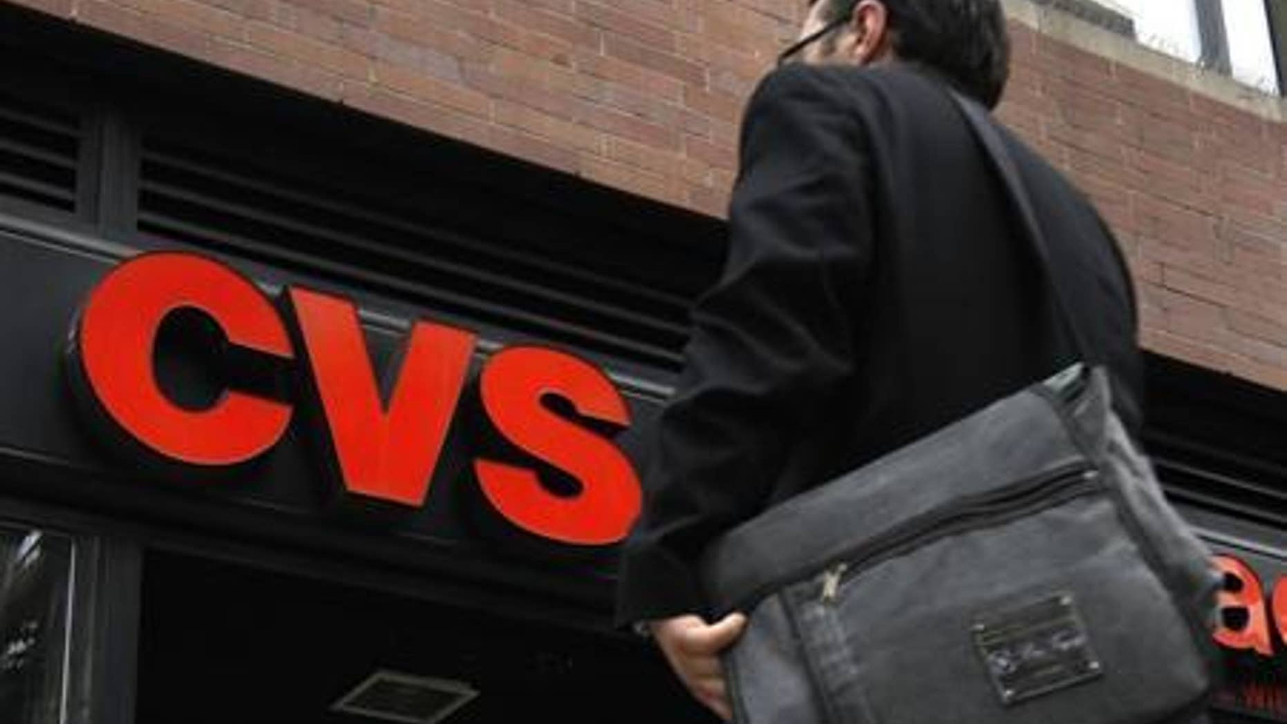 A man walks outside CVS pharmacy in New York City July 28, 2010. REUTERS/Mike Segar