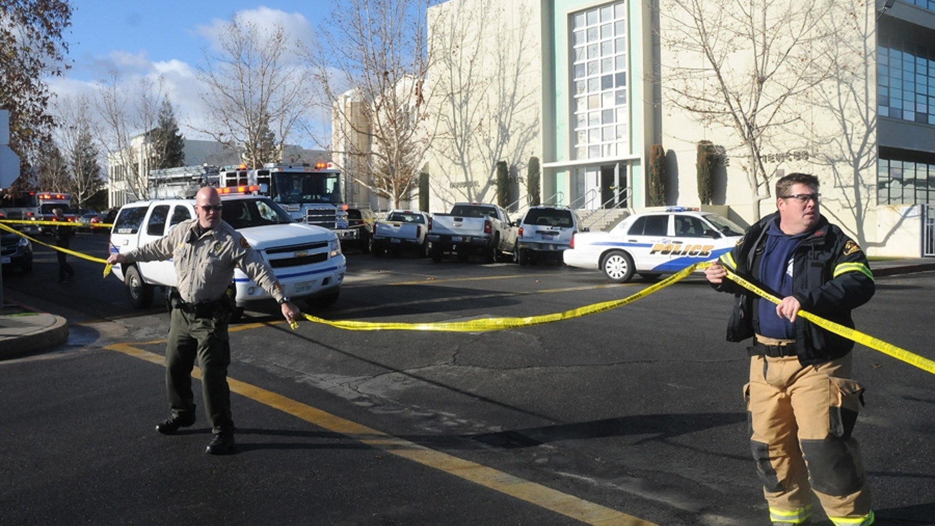 Jan. 10, 2013: This image provided by the Taft Midway Driller/Doug Keeler shows officials taping off an area outside San Joaquin Valley high school in Taft, Calif.