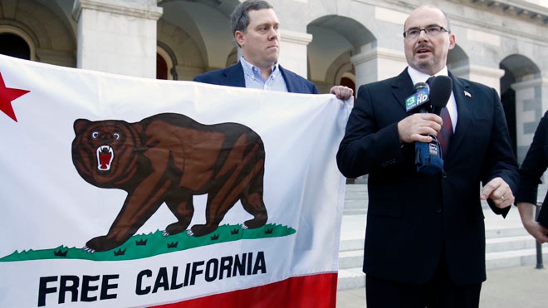 Oct. 24, 2013: Assemblyman Tim Donnelly, R-Twin Peaks, right, flanked by Tim Knight, who led the recall movement in Colorado against two state legislators for the votes on gun control laws, announced that they are considering a recall campaign against five Democratic state lawmakers for their support of gun control bills in California, during a news conference in Sacramento, Calif.