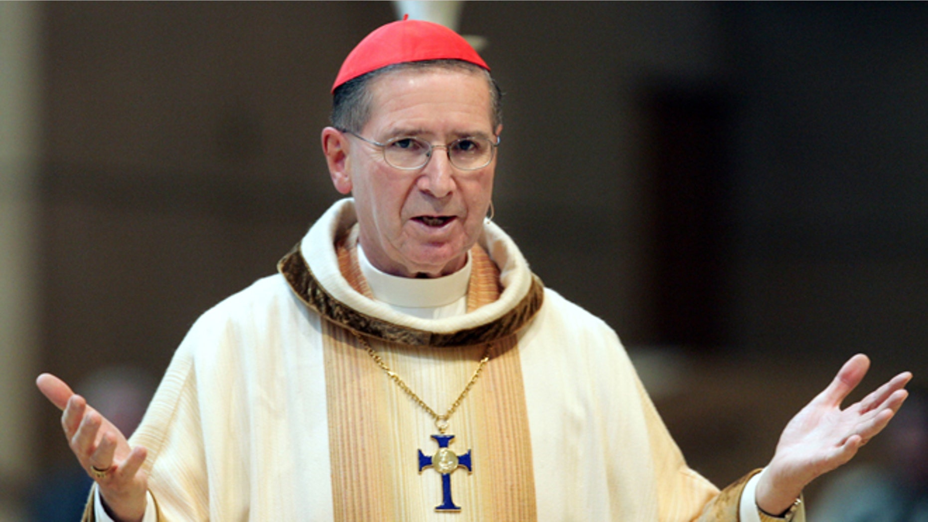 FILE - In this May 10, 2006 file photo, Cardinal Rogery Mahony celebrates mass at the Cathedral of Our Lady of the Angels in Los Angeles. The Roman Catholic Archdiocese of Los Angeles will pay nearly $10 million to settle four clergy sex abuse cases that alleged abuse by a now-defrocked priest who told Mahony nearly 30 years ago he had molested children, attorneys confirmed on Tuesday March 12, 2013. (AP Photo/Reed Saxon, File)