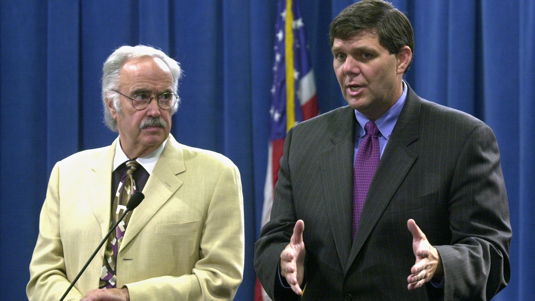 In this July 24, 2003 file photo, then State Sen. Minority Leader Jim Brutle, right, speaks next to then Senate President Pro tem John Burton, D-San Francisco, left, during a Capitol news conference in Sacramento, Calif.