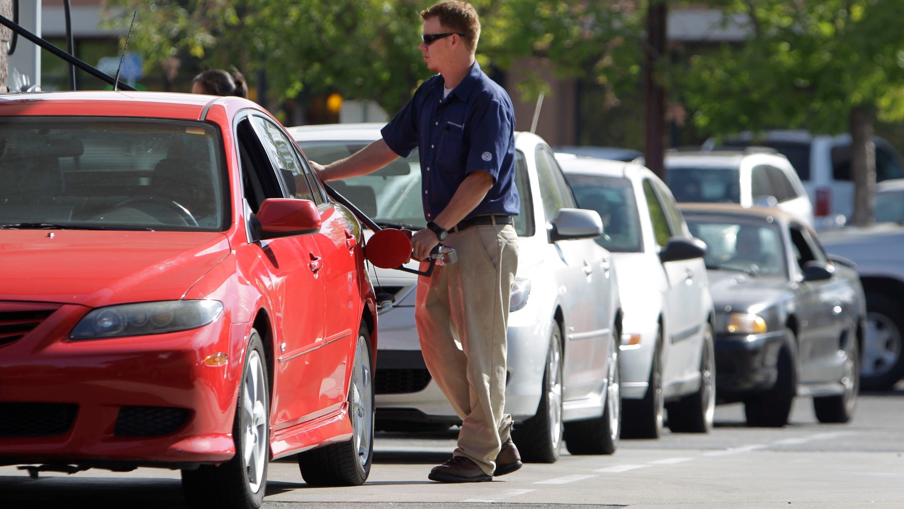 Cars line up to get gas at a Costco gas station in Sacramento, Calif., Friday, Oct. 5, 2012. Californians woke up to a shock Friday as overnight gasoline prices jumped by as much as 20 cents a gallon in some areas, ending a week of soaring costs that saw some stations close and others charge record prices. The average price of regular gas across the state was nearly $4.49 a gallon, the highest in the nation, according to AAA's Daily Fuel Gauge report. (AP Photo/Rich Pedroncelli)