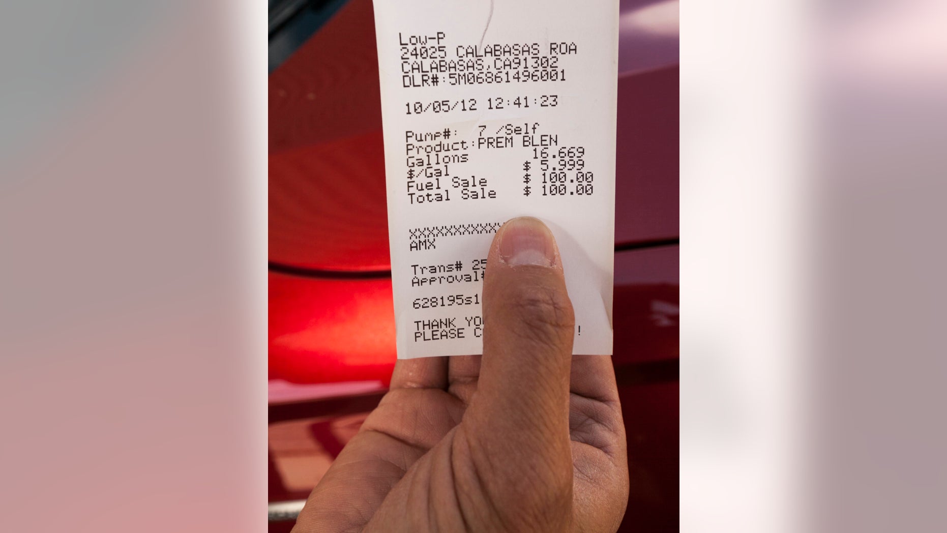 Oct. 5, 2012 - A motorist shows his gas receipt at Low-P, an independent gas station in Calabasas, California