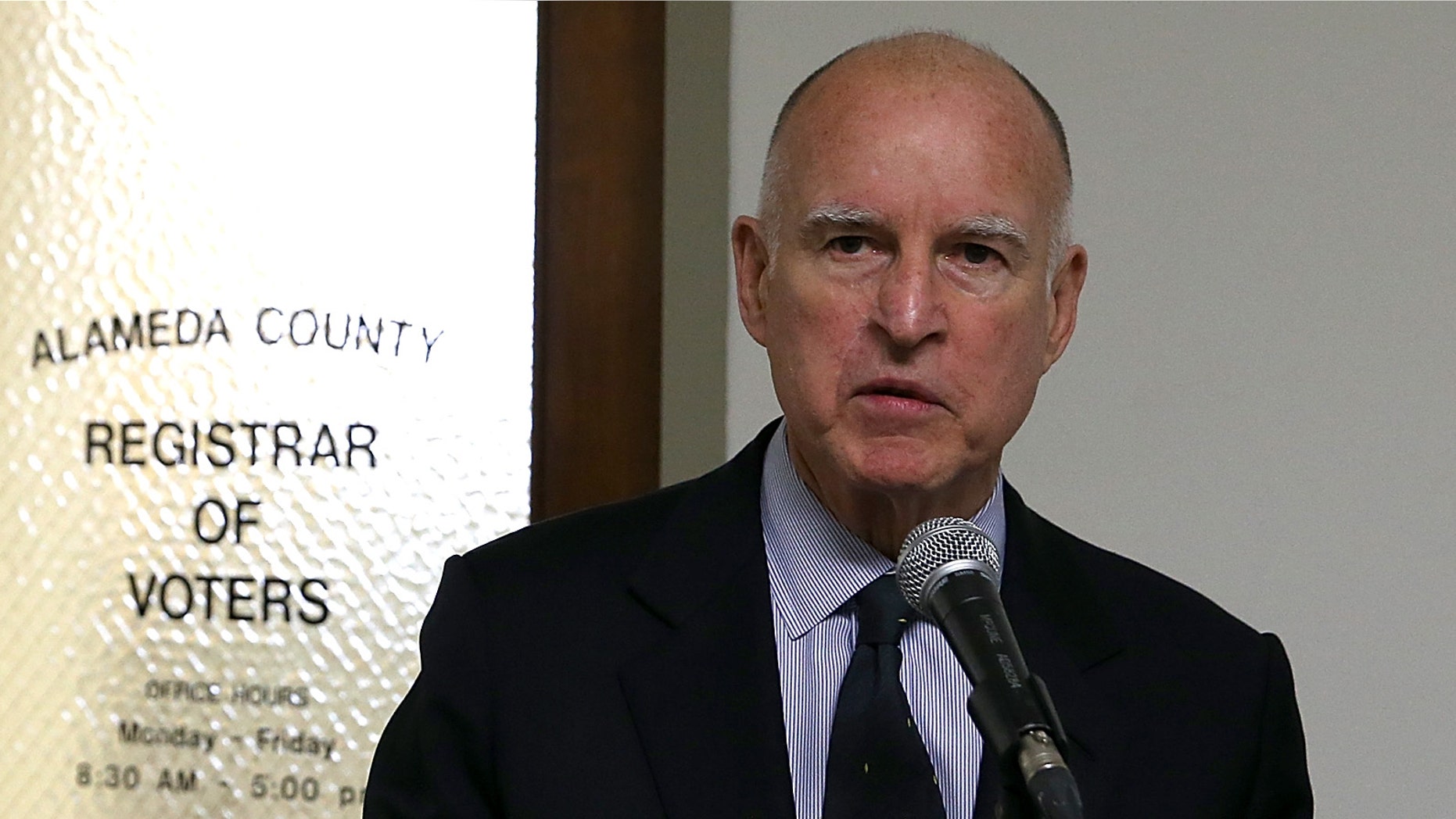 OAKLAND, CA - FEBRUARY 28: Anne Gust Brown (L) looks on as her husband, California Gov. Jerry Brown, speaks to reporters after filing paperwork for re-election at the Alameda County Registrar of Voters> on February 28, 2014 in Oakland, California. Gov. Brown submitted paperwork to officially launch his 2014 re-election campaign. (Photo by Justin Sullivan/Getty Images)