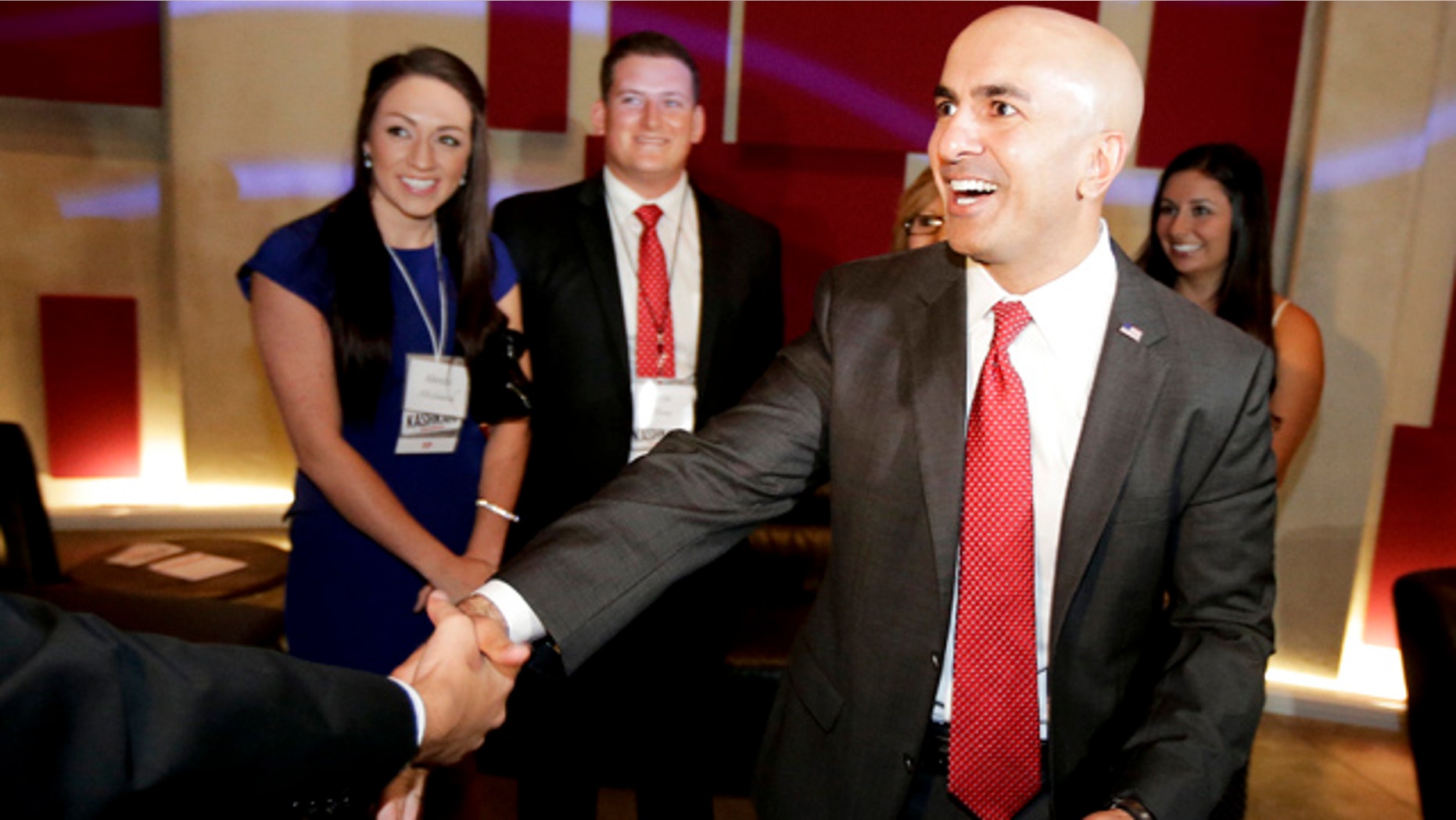June 3, 2014: California Republican Gubernatorial Candidate Neel Kashkari greets supporters during an election night party at the Port Theater in the Corona Del Mar area of Newport Beach, Calif. Two Republicans are vying for the chance to challenge Gov. Jerry Brown in November. (AP Photo/Chris Carlson)