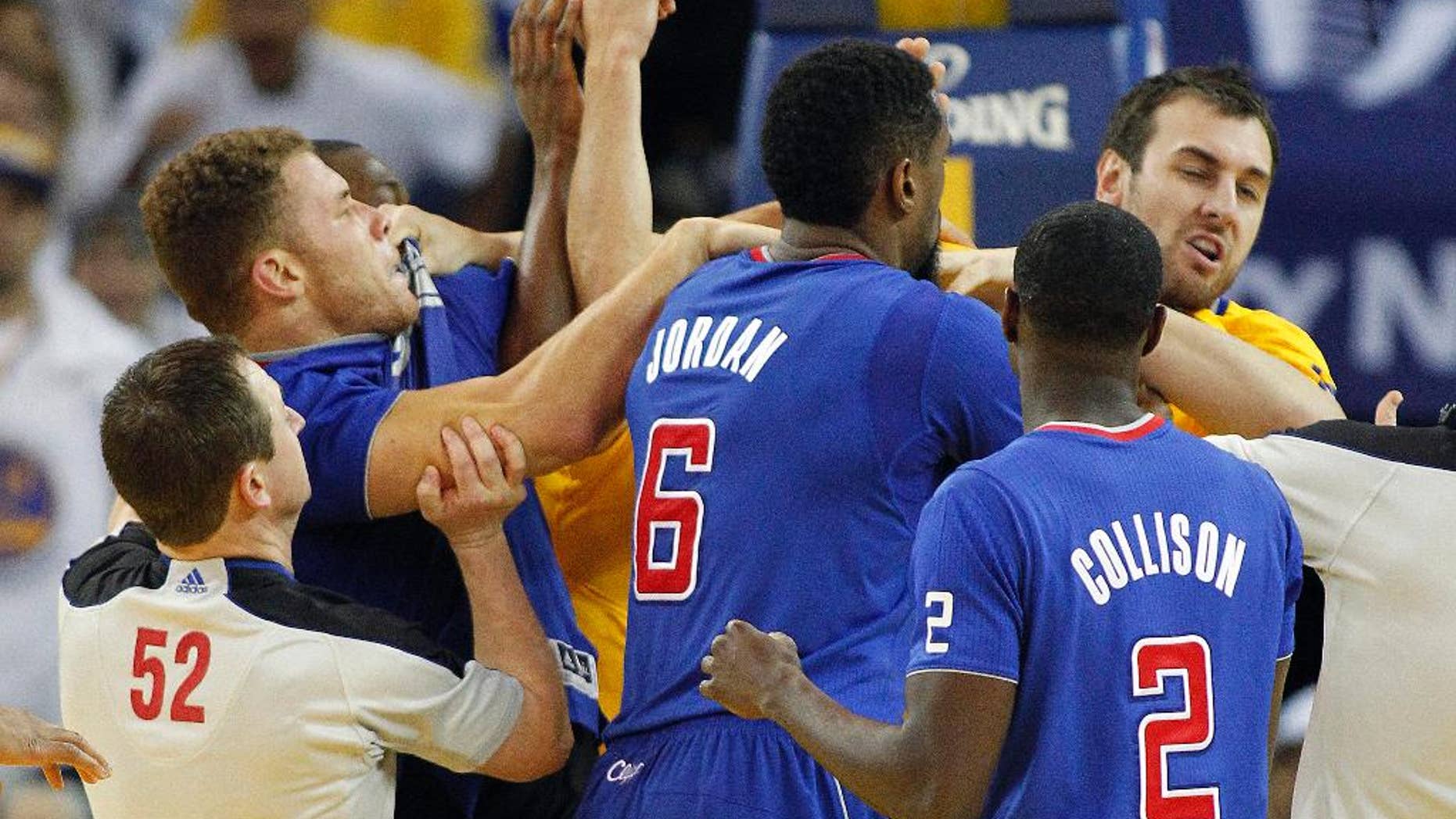 FILE - In this Dec. 25, 2013, file photo, Los Angeles Clippers power forward Blake Griffin, left, fights with Golden State Warriors center Andrew Bogut, right, as Clippers center DeAndre Jordan (6) and Darren Collison (2) look on during the second half of an NBA basketball game in Oakland, Calif. The alley-oops in Lob City, the deep 3-pointers by the Splash Brothers and the overall bitterness between the Los Angeles Clippers and Golden State Warriors should make for one of the most entertaining series in the first round of the NBA playoffs. Whether the up-and-down style both teams play can carry either to a championship this year or in the future remains a topic of debate. (AP Photo/Tony Avelar, File)
