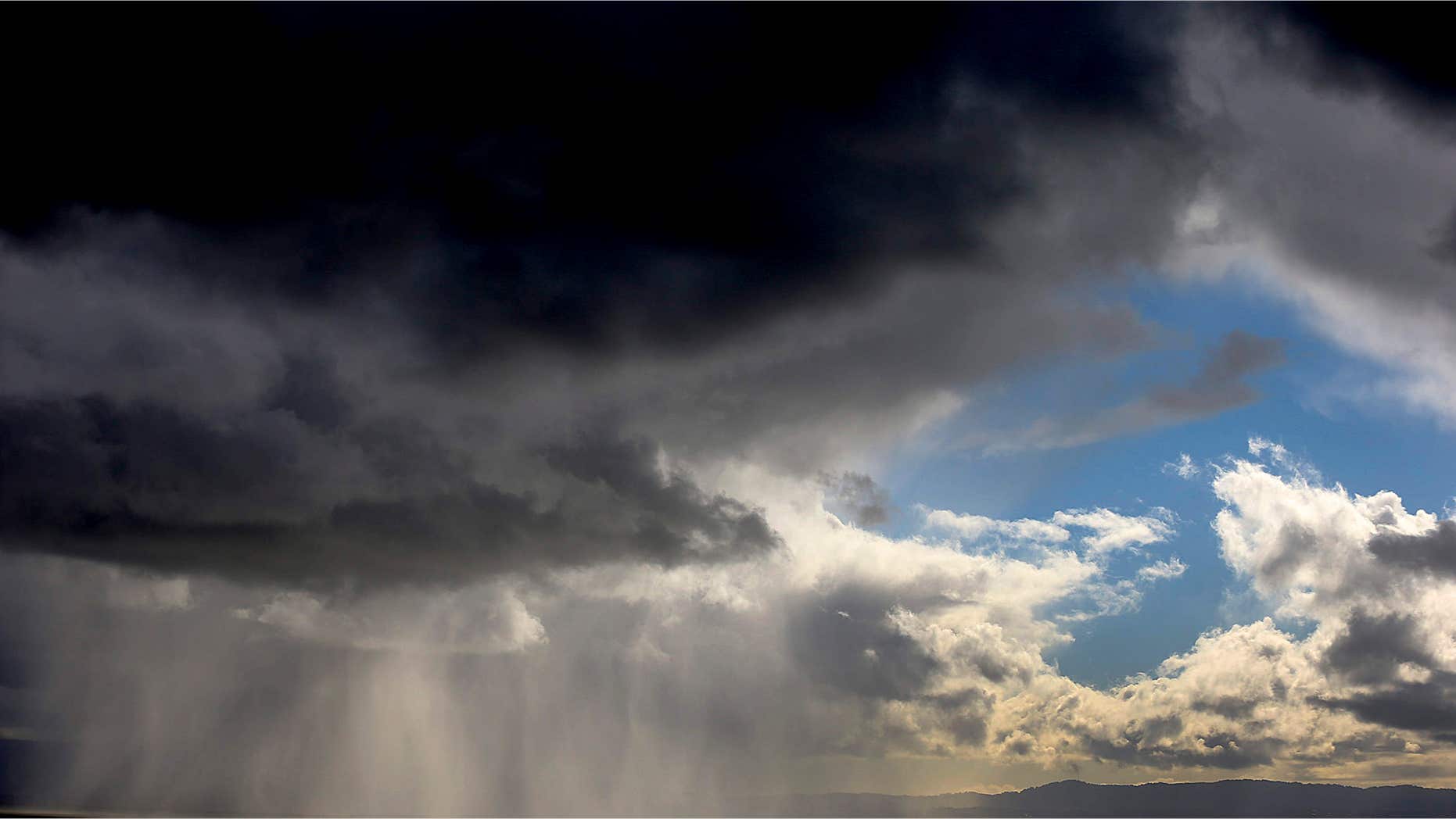 April 7, 2015: Storm clouds and rain move across the San Francisco Bay