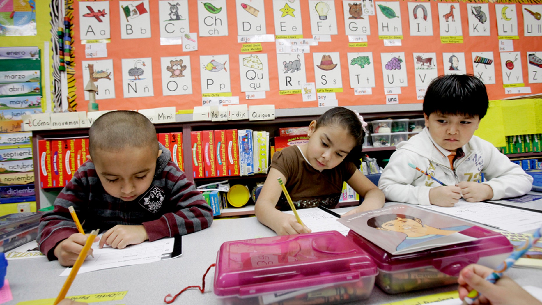 In this photo made Tuesday, Feb. 15, 2011, five-year-old kindergarden students Gael Alvarado, left, Perla Ortiz, center, and Yahir Perez do school work in a bilingual english-spanish class at Hanby Elementary School in Mesquite, Texas. Mesquite ISD, like many districts in Texas, has seen a demographic shift in the racial make up students over the past 10 years. Hispanics account for two-thirds of Texas' growth over the past decade and now make up 38 percent of the state's total population, according to new local U.S. Census figures released Thursday, Feb. 17, 2011. (AP Photo/LM Otero) (AP Photo/LM Otero)