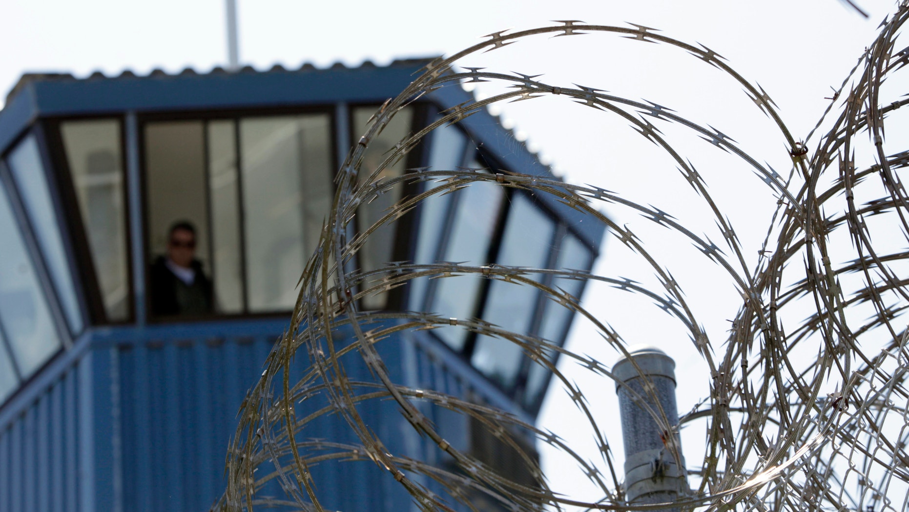 Concertina wire and a guard tower are seen at Pelican Bay State Prison near Crescent City, Calif.