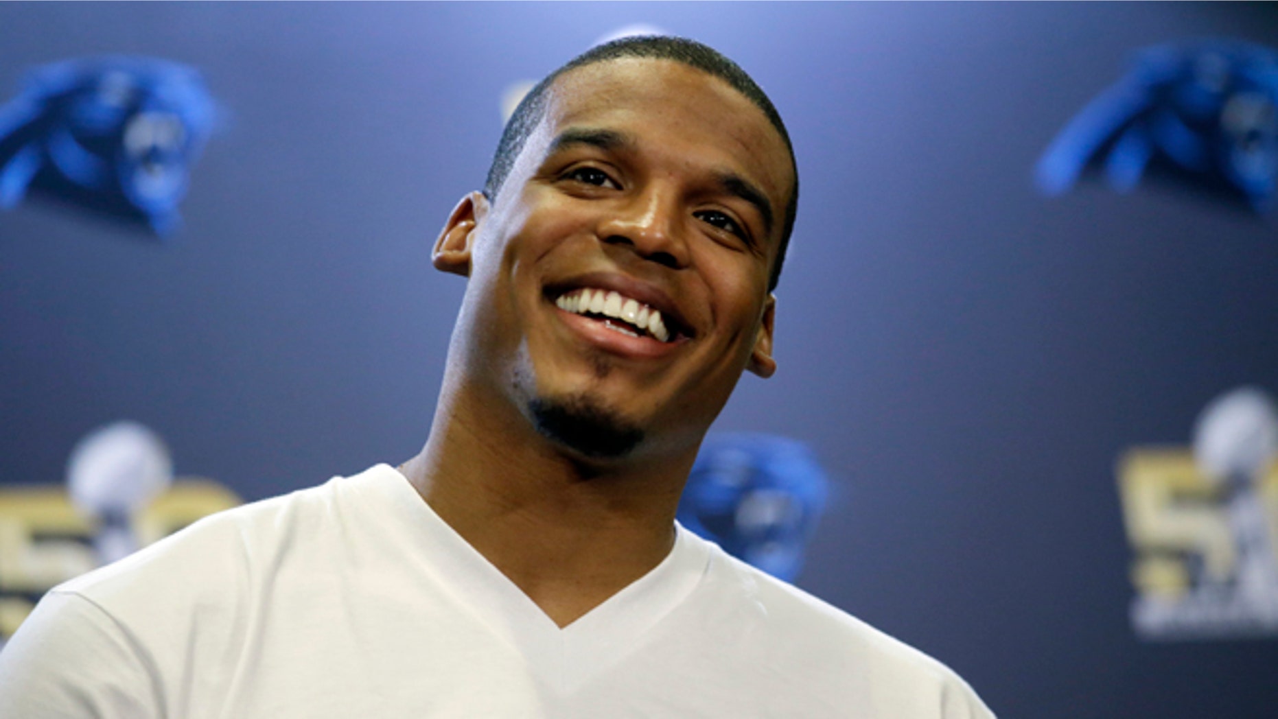 Carolina Panthers quarterback Cam Newton smiles as he answers questions during a press conference Tuesday, Feb. 2, 2016 in San Jose, Calif. Carolina plays the Denver Broncos in the NFL Super Bowl 50 football game Sunday, Feb. 7, 2015, in Santa Clara, Calif. (AP Photo/Marcio Jose Sanchez)