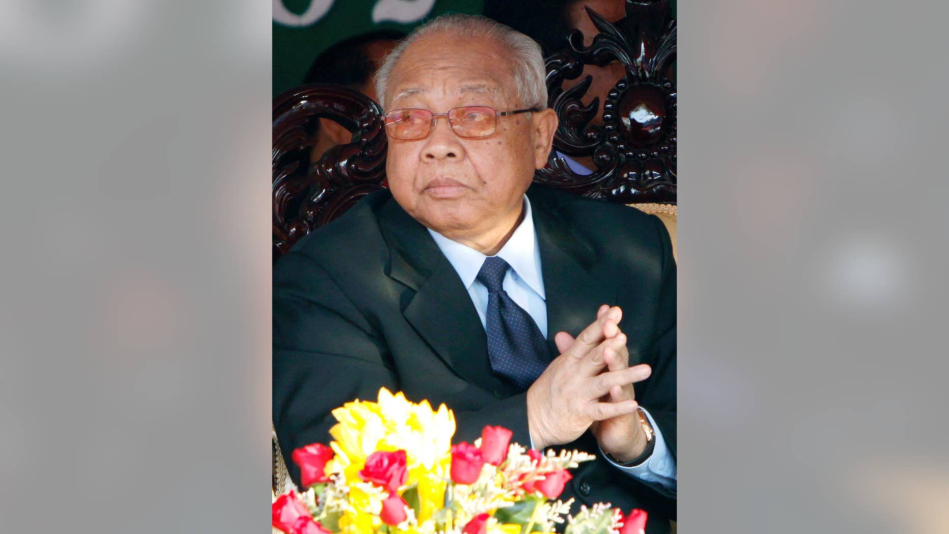 FILE - In this Jan. 7, 2010, file photo, Chea Sim, president of the ruling Cambodian People's Party, prays as the country marks the end of Khmer Rouge rule in Phnom Penh, Cambodia. Chea Sim, a key Cambodian political figure after the fall of the brutal Khmer Rouge regime who was an ally and rival of Prime Minister Hun Sen, has died at age 82, the head of his bodyguard unit said Monday, June 8, 2015. He had been in ill health for many years, and hospitalized for the past few months. (AP Photo/Heng Sinith, File)