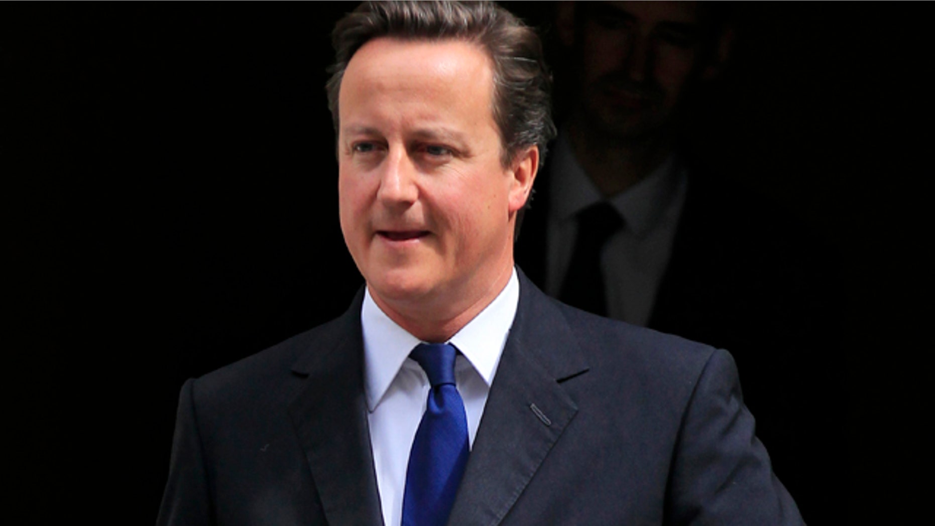 July 12: British Prime Minister David Cameron leaves 10 Downing Street.