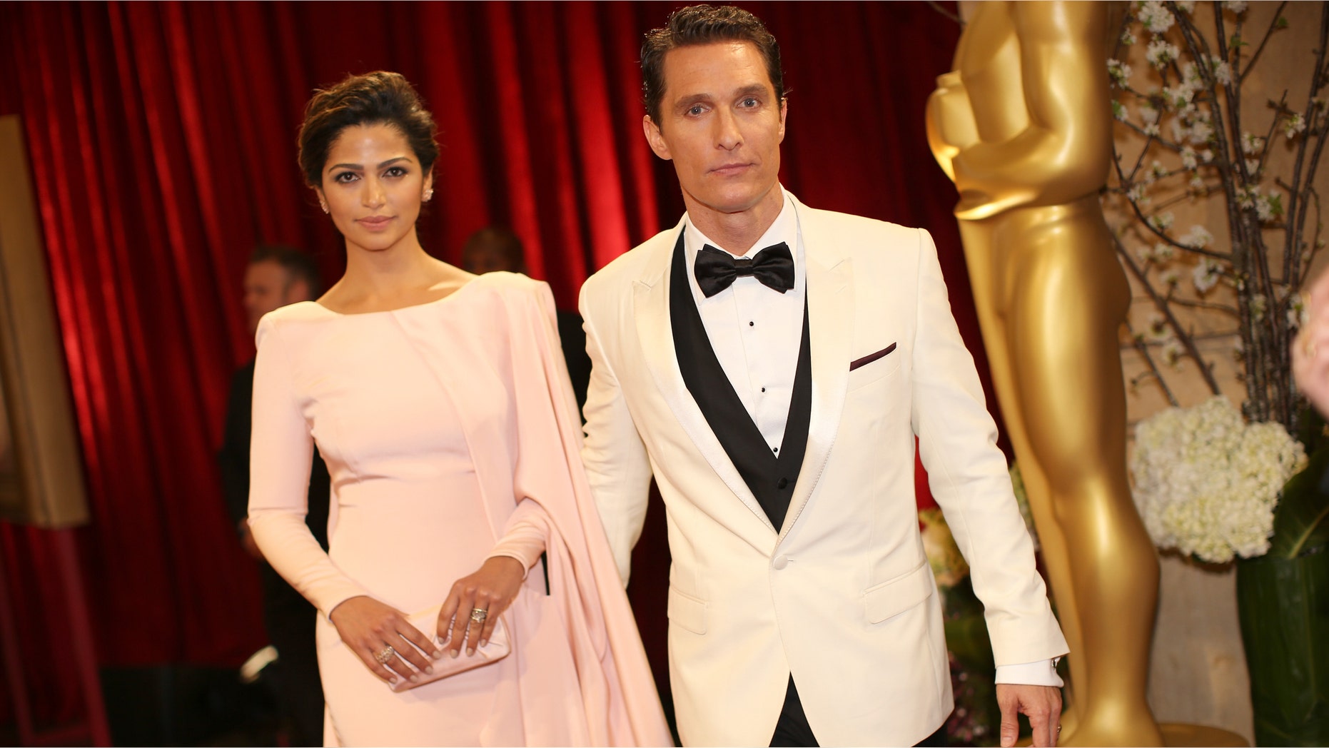 HOLLYWOOD, CA - MARCH 02: Actor Matthew Conaughey (R) and model Camilla Alves attend the Oscars held at Hollywood & Highland Center on March 2, 2014 in Hollywood, California. (Photo by Christopher Polk/Getty Images)