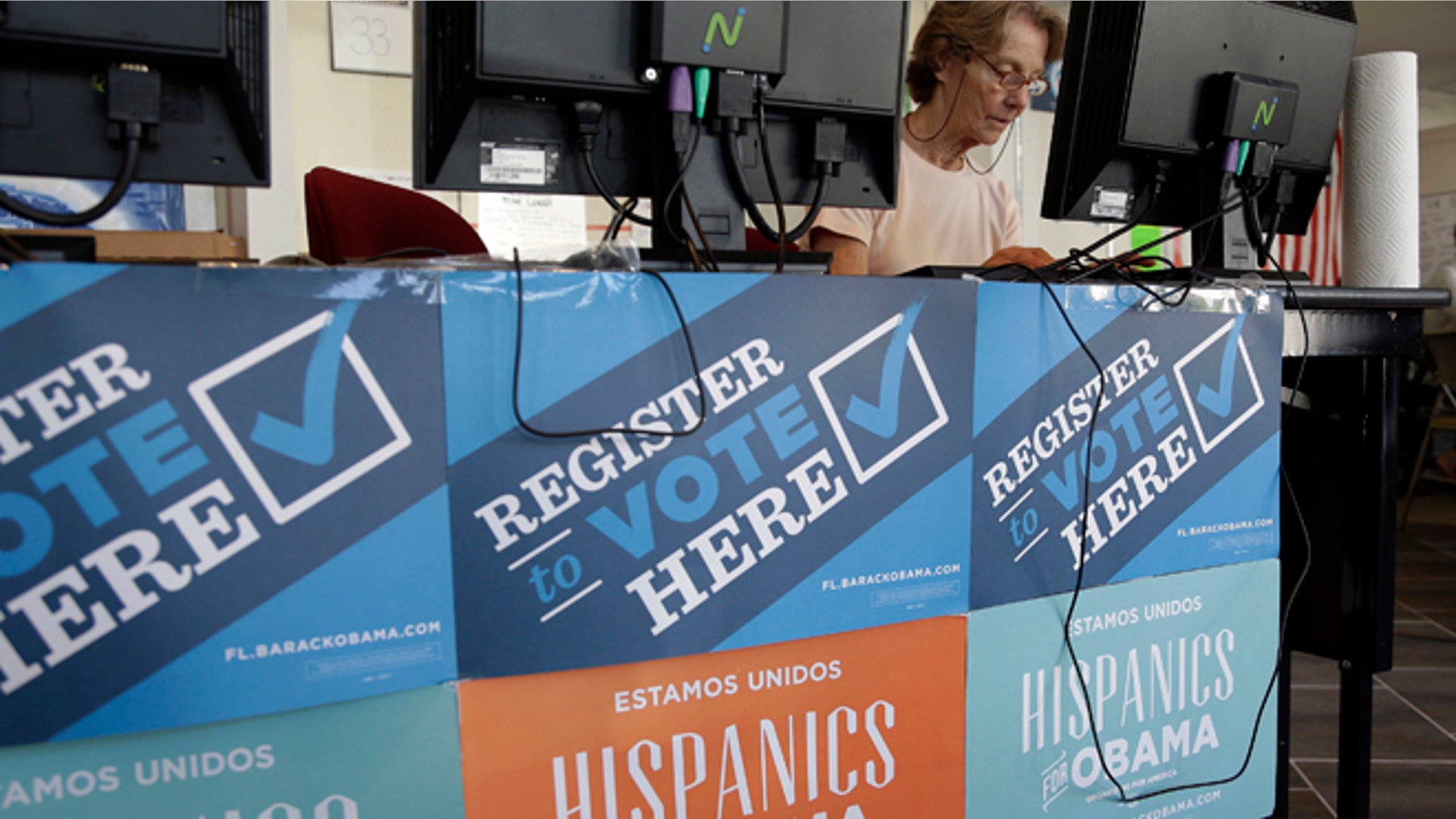 FILE - In this Oct. 8, 2012, file photo, a campaign volunteer inputs voter registration data into a computer at a campaign office for President Barack Obama, Monday, Oct. 8, 2012 in Miami. The vaunted data-driven machine that twice got Obama elected is dusting itself off to help elect Hillary Clinton, as Democrats look to recreate the tactical advantage they used against Republicans in 2008 and 2012.(AP Photo/Lynne Sladky, file)