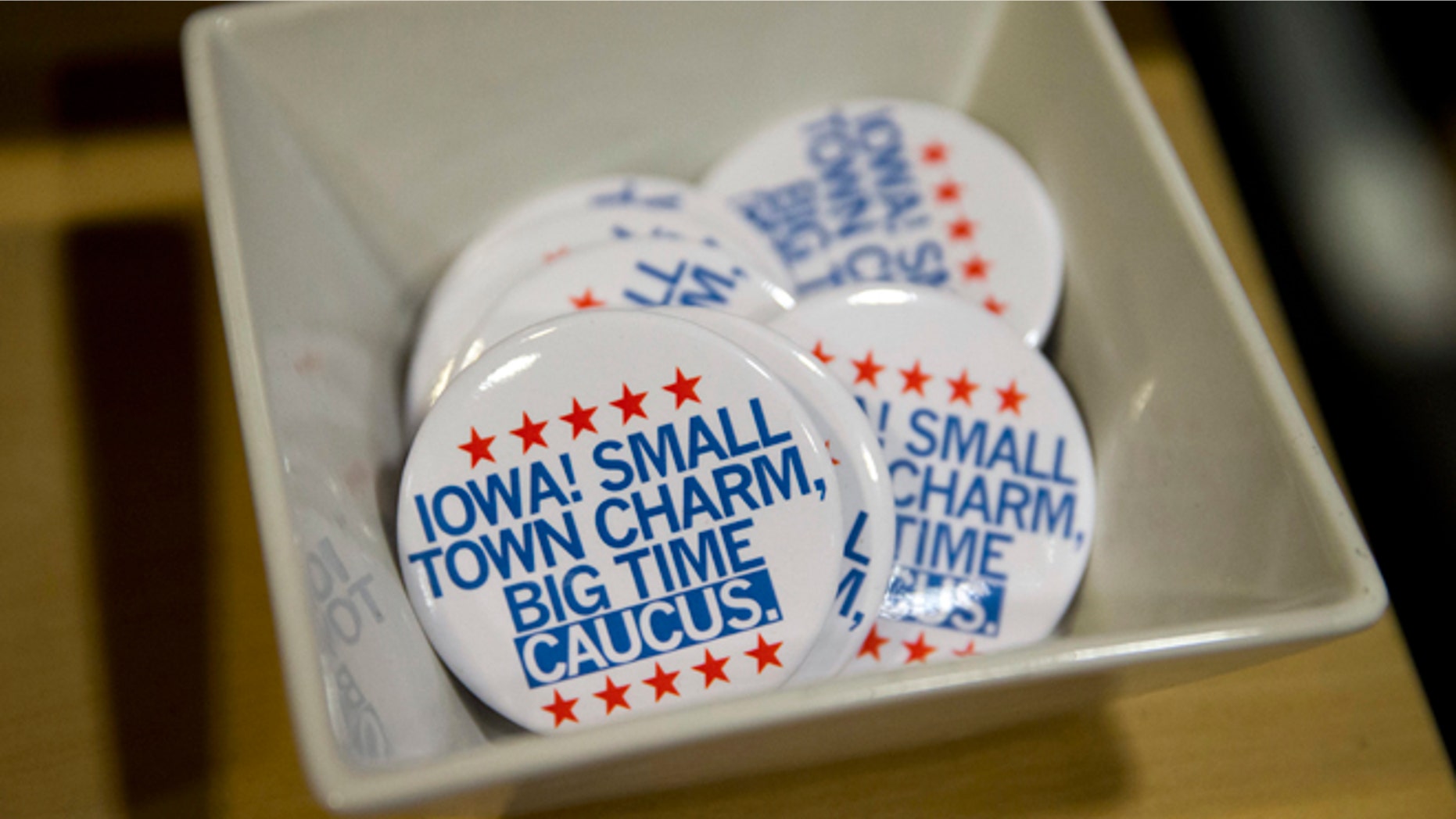 In this Jan. 21, 2016, photo, political buttons are for sale at a gift shop in Des Moines, Iowa. For some Americans, the promise of political change and disruption has come too slowly, or failed altogether. On the eve of the first voting contest in the 2016 presidential election, these voters are pushing for bolder, more uncompromising action, with an intensity that has shaken both the Republican and Democratic establishment. (AP Photo/Jae C. Hong)