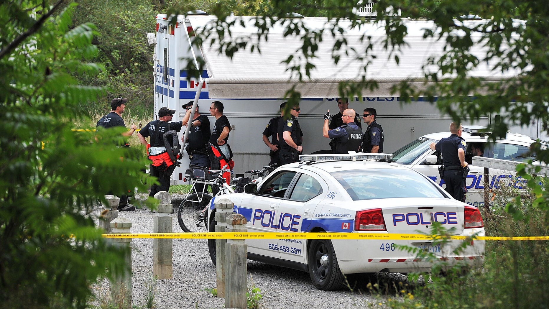 Aug. 16, 2012 - FILE photo of police team in Hewick Meadows Park in Mississauga, Ont., after discovering a female severed head in the Credit River.