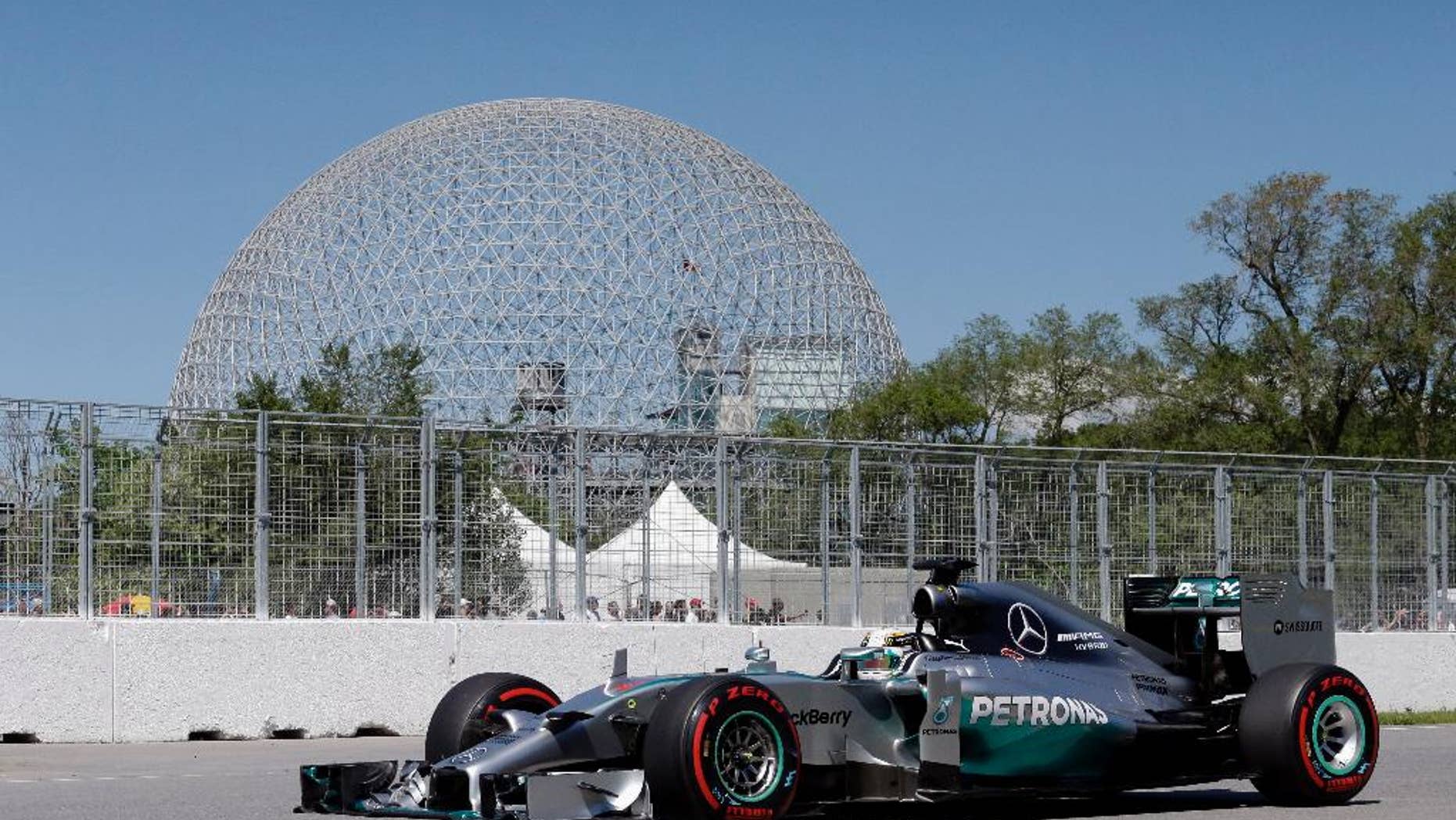 Mercedes driver Lewis Hamilton, from Great Britain, drives through the course during a practice session at the Canadian Grand Prix, Saturday, June 7, 2014, in Montreal. (AP Photo/AP Photo/David J. Phillip)
