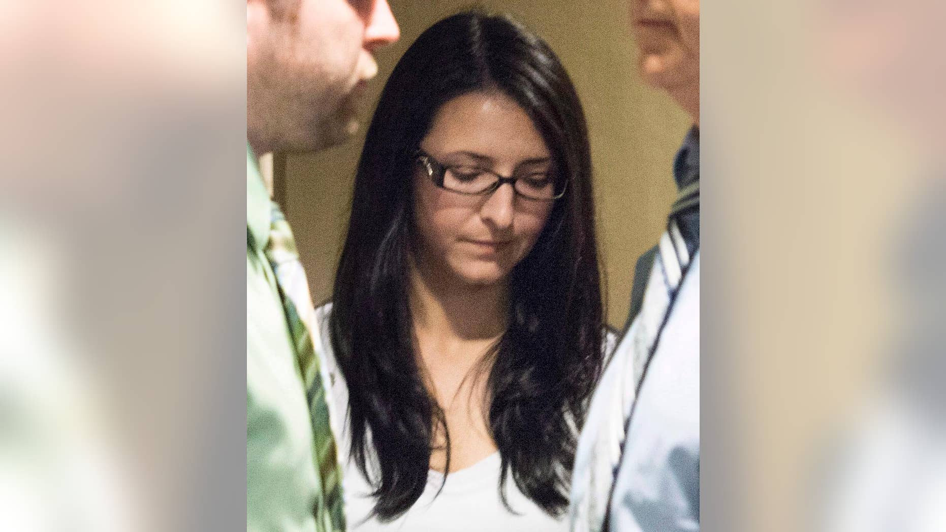 In a Tuesday, June 3, 2014 photo, Emma Czornobaj is pictured at the Montreal Courthouse in Montreal. Czornobaj, who stopped to help a group of ducklings on the side of the road, was found guilty Friday, June 20, 2014, of causing the deaths of a motorcyclist and his passenger daughter who slammed into her parked car on on June 27, 2010. (AP Photo/The Canadian Press, Graham Hughes)