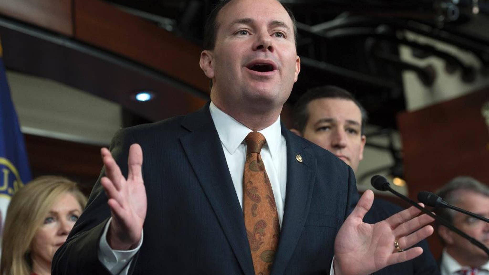 FILE - In this Feb. 12, 205 file photo, Sen. Mike Lee, R-Utah speaks during a news conference on Capitol Hill in Washington. Lee is raising money off his opposition to the National Security Agency’s surveillance programs. And he’s hoping the NSA will spy on him and find out all about it. The Utah Republican, who is up for re-election next year, is asking supporters to donate to his campaign and sign a petition backing his legislative efforts to end the NSA's collection and storage of Americans’ phone records. (AP Photo/Molly Riley, File)