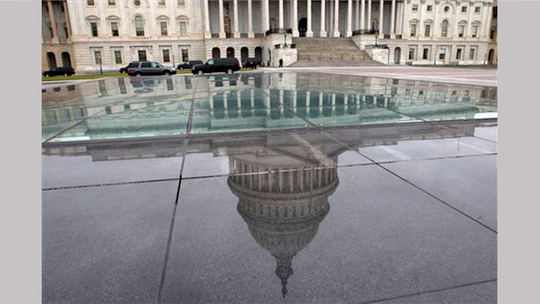 FILE - In this Tuesday, Jan. 1, 2013, file photo, the dome of the Capitol is reflected in a skylight of the Capitol Visitor's Center in Washington.