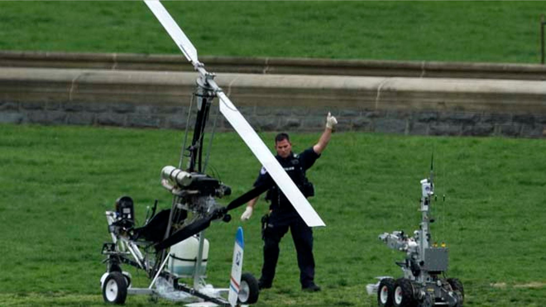April 15: A Capitol Police officer flashes a thumbs up after inspecting the small helicopter a man landed on the West Lawn of the Capitol.