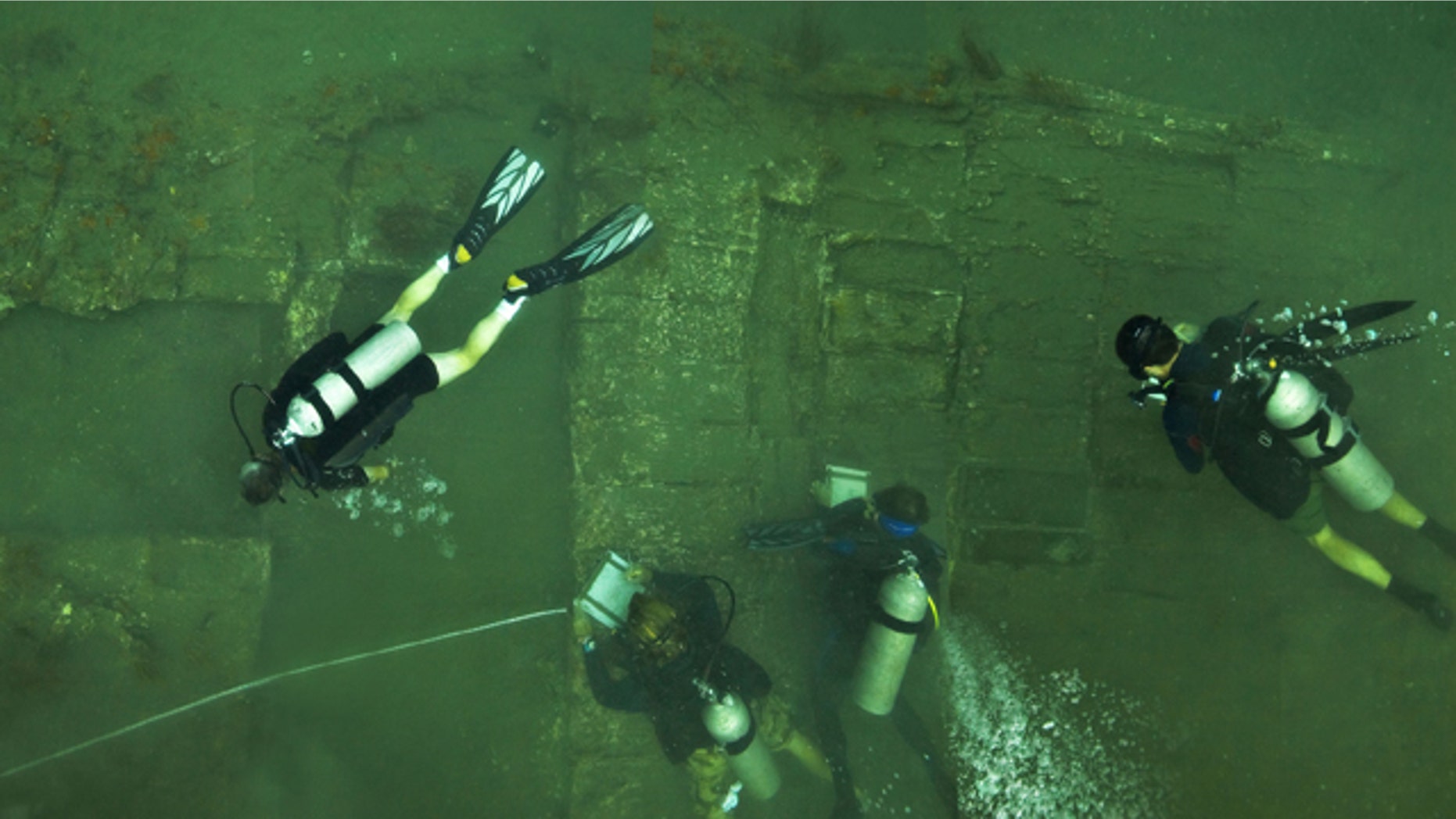 A team of U.S. archaeologists study the wreckage of a ship they believe to be part of pirate captain Henry Morgan's lost vessel. The dive team discovered approximately 52x22 feet of the starboard side of a 17th century wooden ship hull and a series of unopened cargo boxes and chests encrusted in coral.